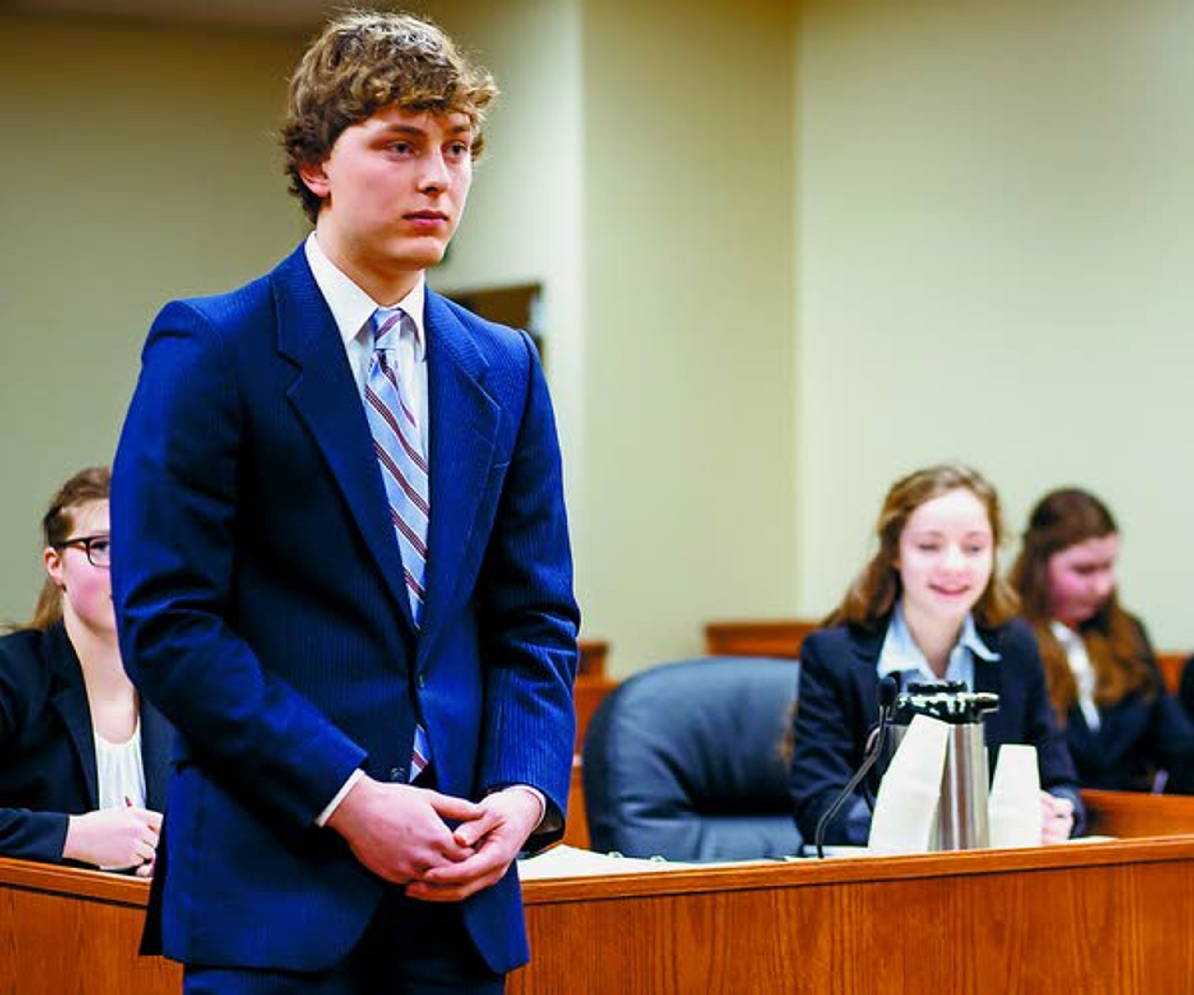 Jameson Evans, acting as a plaintiff's attorney, asks a witness questions during a Logos School mock trial team scrimmage against a group of mock trial alumni on Saturday, Feb. 22, 2014, at the Latah County Courthouse. Latah County prosecutor Bill Thompson acted as judge during the scrimmage.