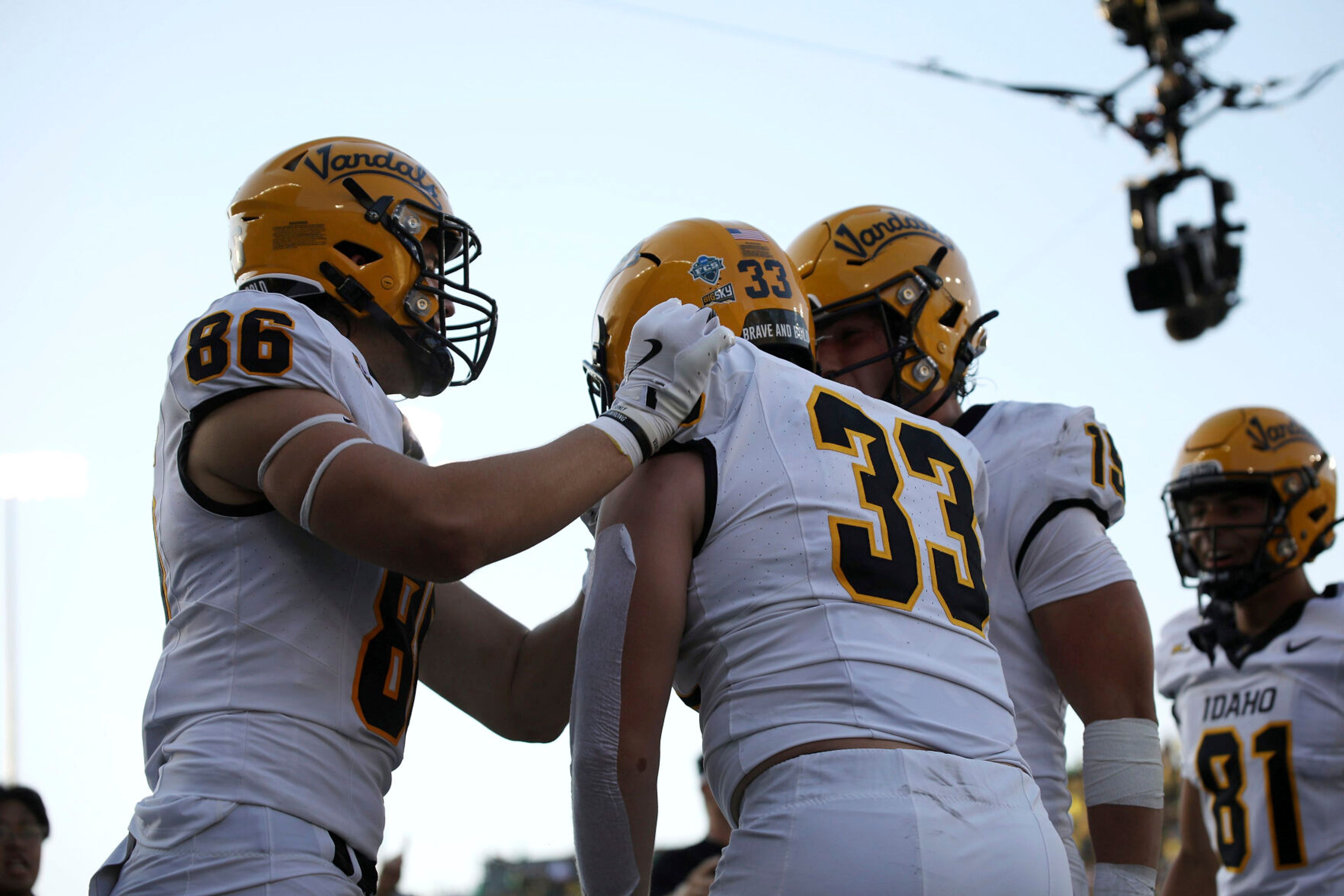 Idaho tight end Mason Mini (86) and wide receiver Mark Hamper (15) congratulate tight end Jake Cox (33) after Cox's touchdown during a game against Oregon on Aug. 31 in Eugene, Ore. On Saturday, the Vandals defeated Wyoming 17-13 in their second straight game against a Football Bowl Subdivision opponent.