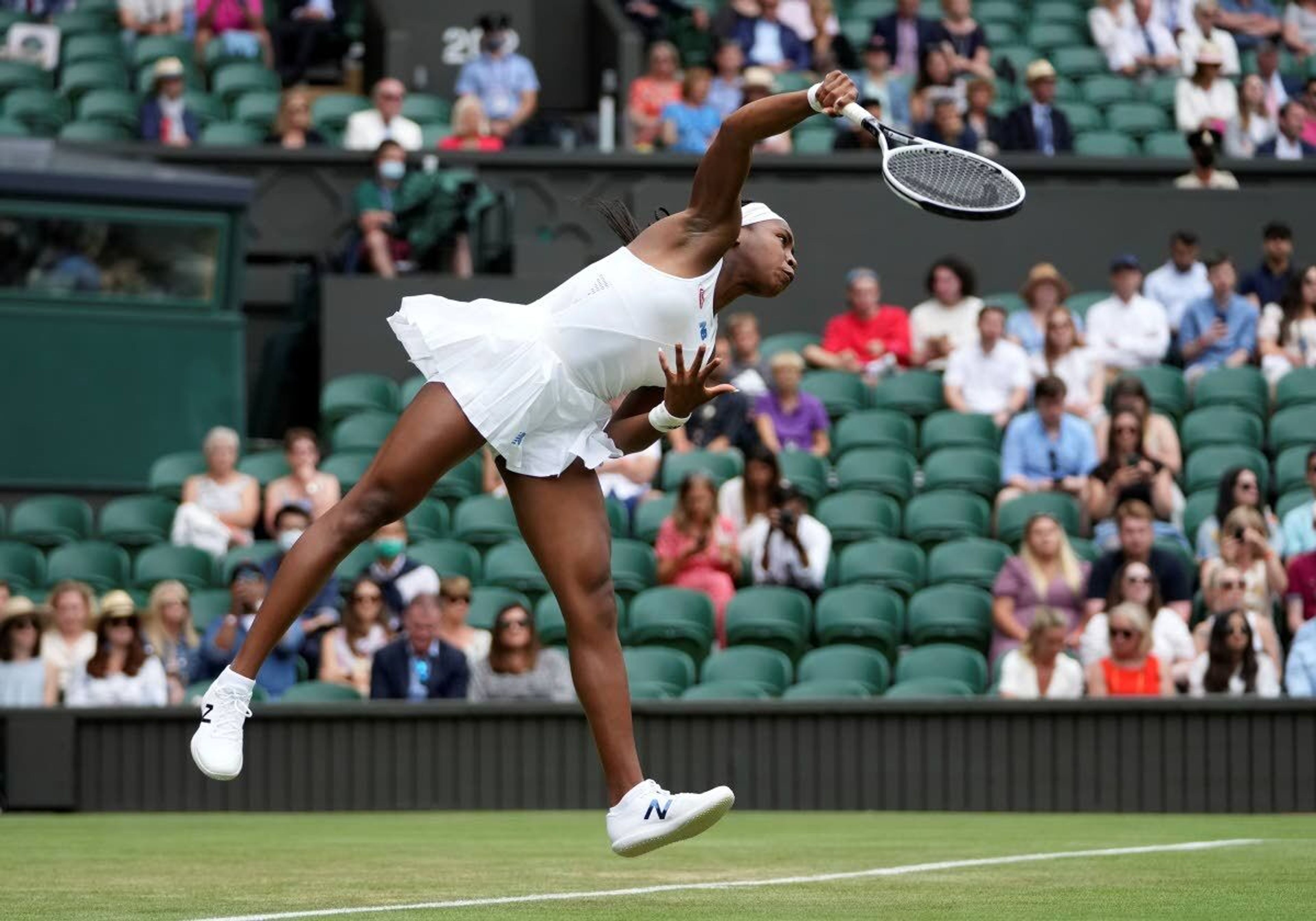 Coco Gauff serves to Russia’s Elena Vesnina during her second-round women’s singles match Thursday at Wimbledon in London. She won 6-4, 6-3.