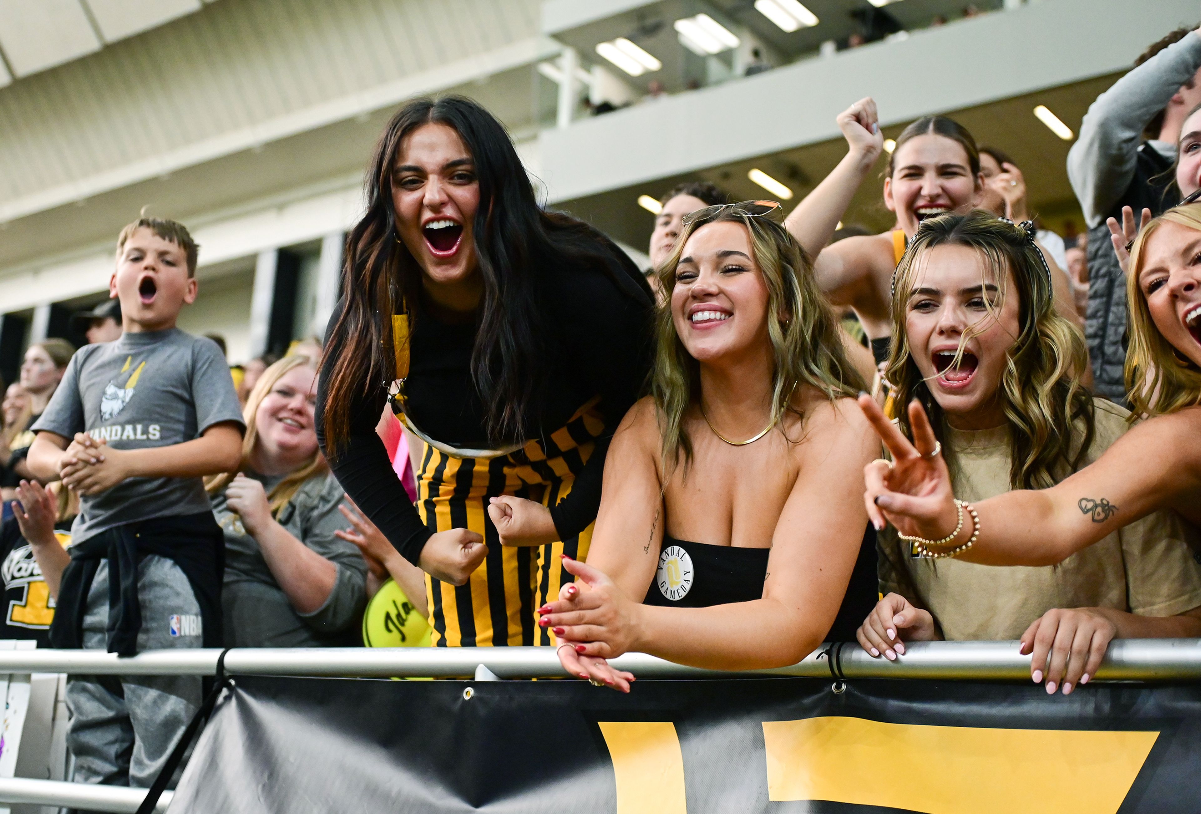 Vandal fans celebrate Idahos win over Northern Arizona Saturday at the P1FCU Kibbie Dome in Moscow.,