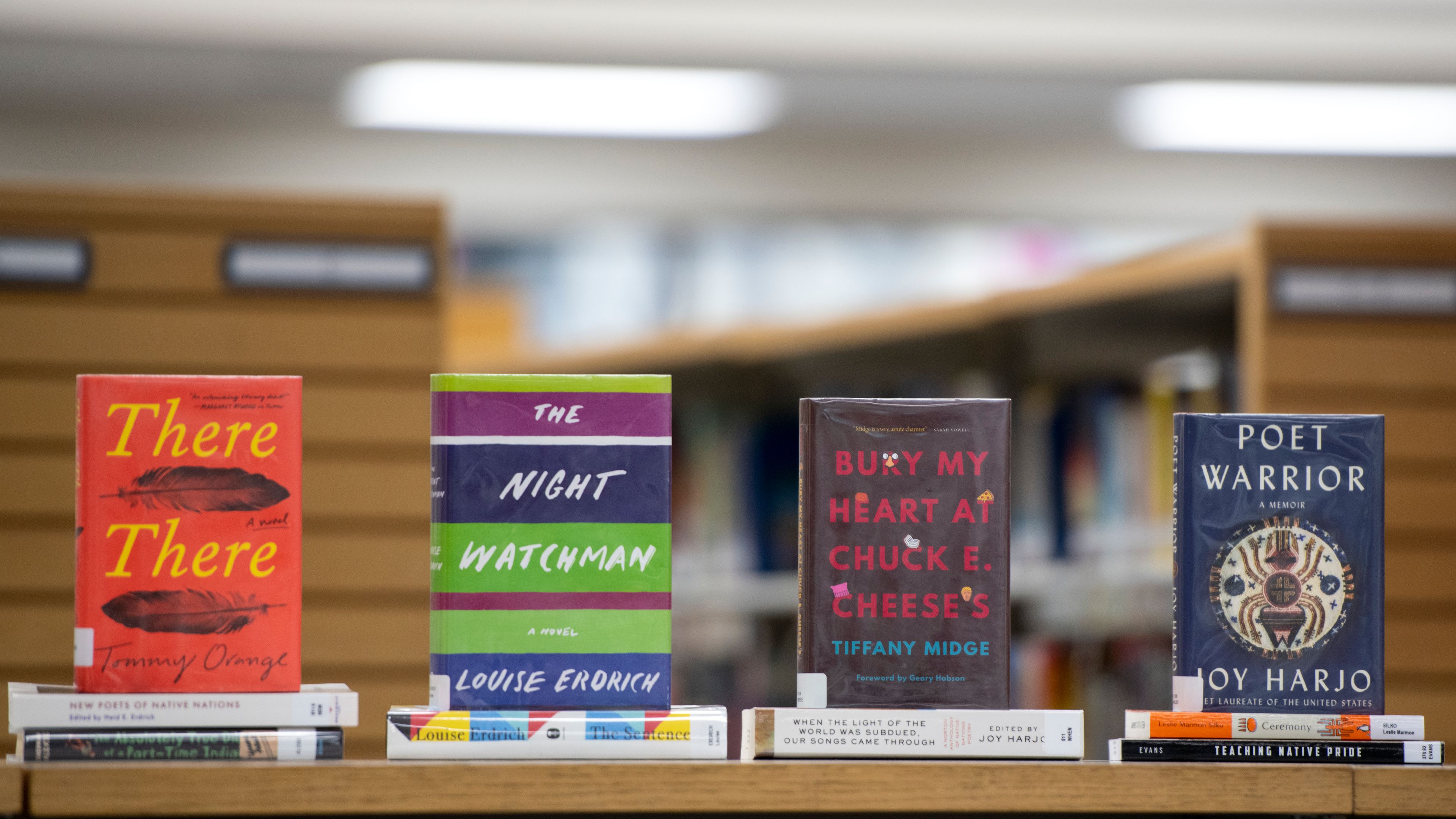 A collection of new books in honor of Native American Heritage Month are stacked Wednesday on a table at the Neill Public Library in Pullman.