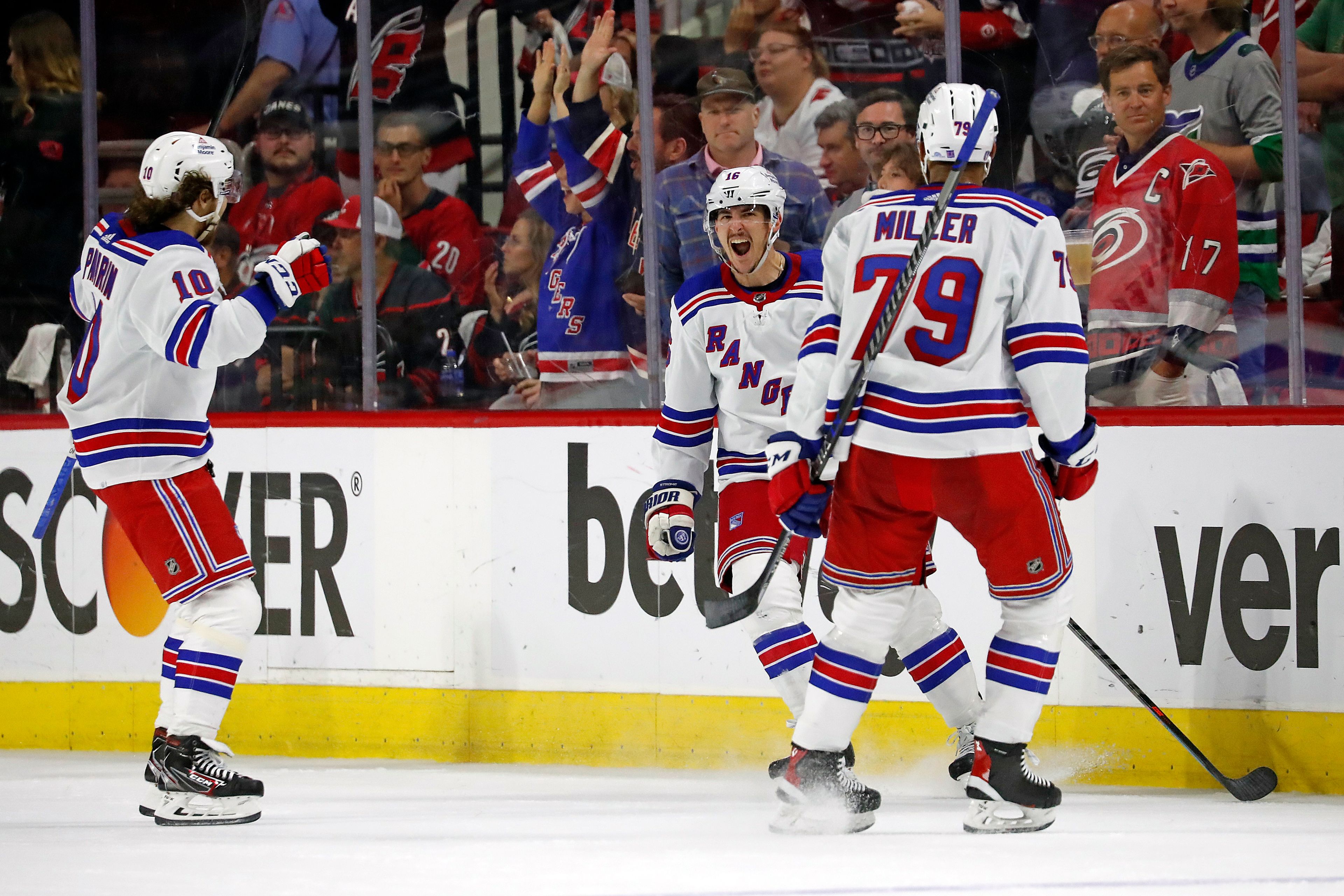 New York Rangers’ Ryan Strome (16) celebrates his goal against the Carolina Hurricanes on Monday with teammates Artemi Panarin (10) and K’Andre Miller (79) during the second period of Game 7 of an NHL hockey Stanley Cup second-round playoff series in Raleigh, N.C.