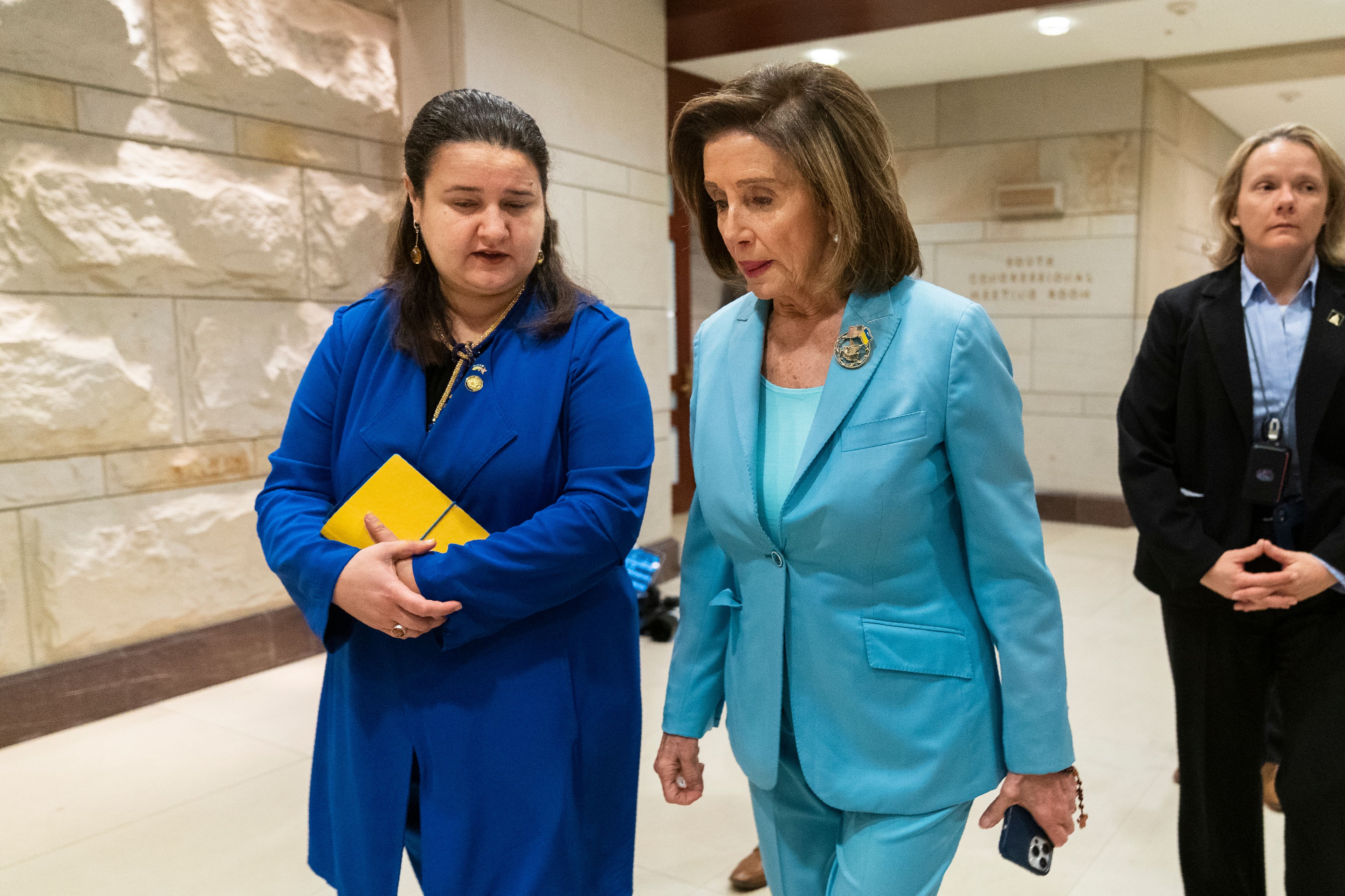 House Speaker Nancy Pelosi of Calif., walks with Ukraine's Ambassador to the United States Oksana Markarova, left, after watching the video address by Ukrainian President Volodymyr Zelenskyy to the U.S. Congress at the Capitol in Washington, Wednesday, March 16, 2022. (AP Photo/Manuel Balce Ceneta)