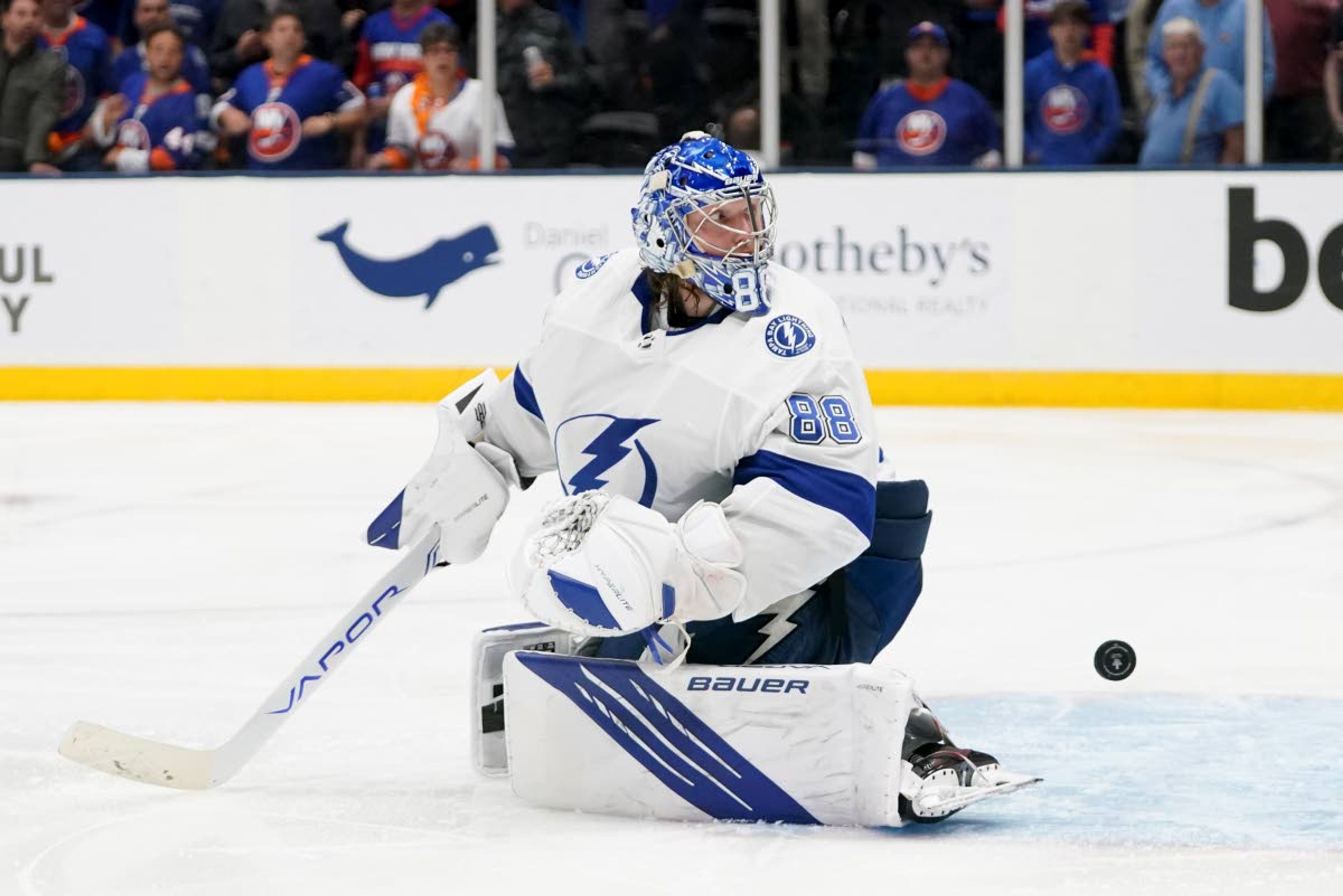 Tampa Bay Lightning goaltender Andrei Vasilevskiy (88) looks back for the puck after it bounced back out of the net on an overtime goal by New York Islanders left wing Anthony Beauvillier (18) during Game 6 of the NHL hockey Stanley Cup semifinals, Wednesday, June 23, 2021, in Uniondale, N.Y. The Islanders won 3-2. (AP Photo/Frank Franklin II)