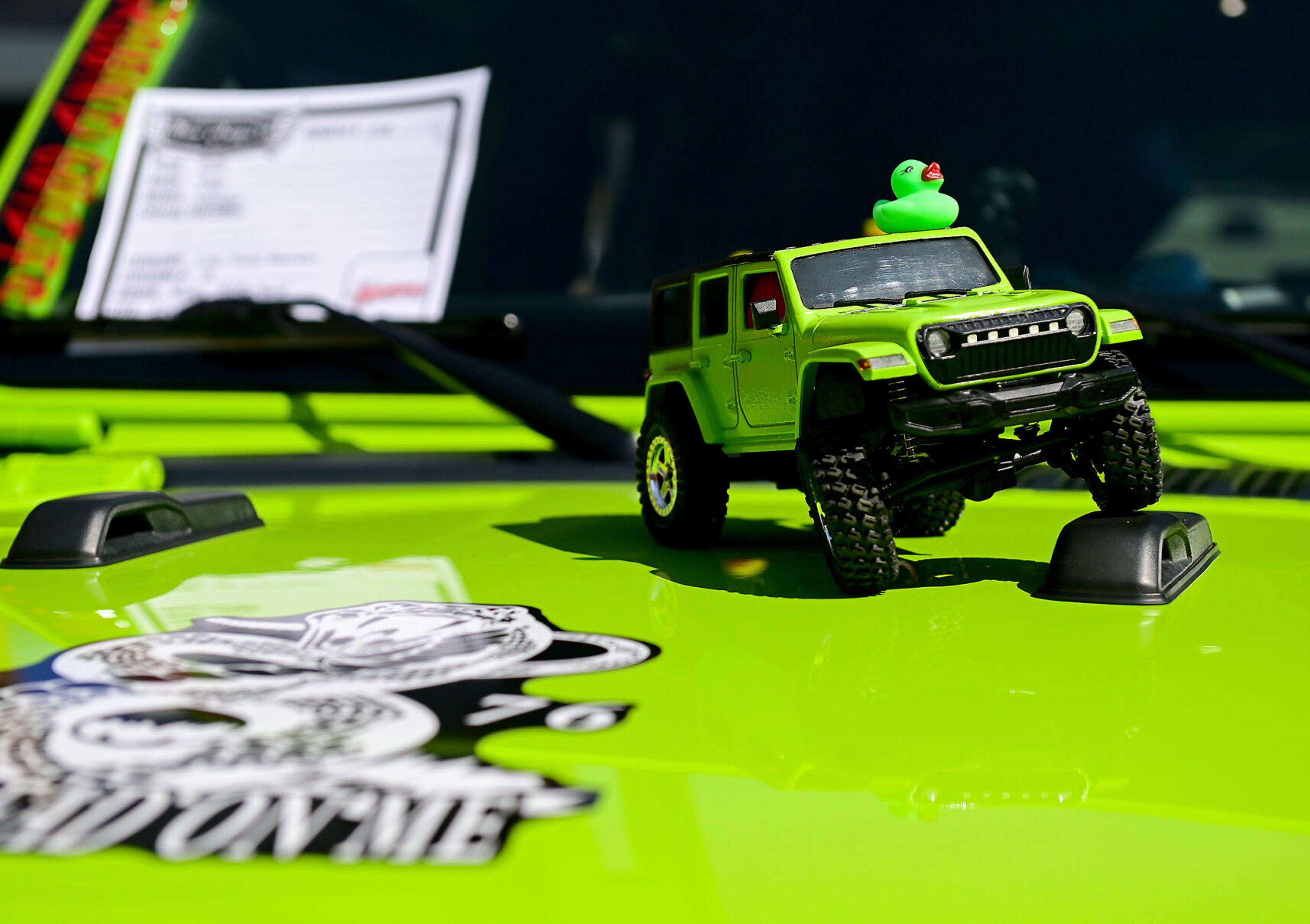 A 2021 Jeep Wrangler sports a matching miniature on its hood at the at the Lewiston Hot August Nights car show on Saturday.