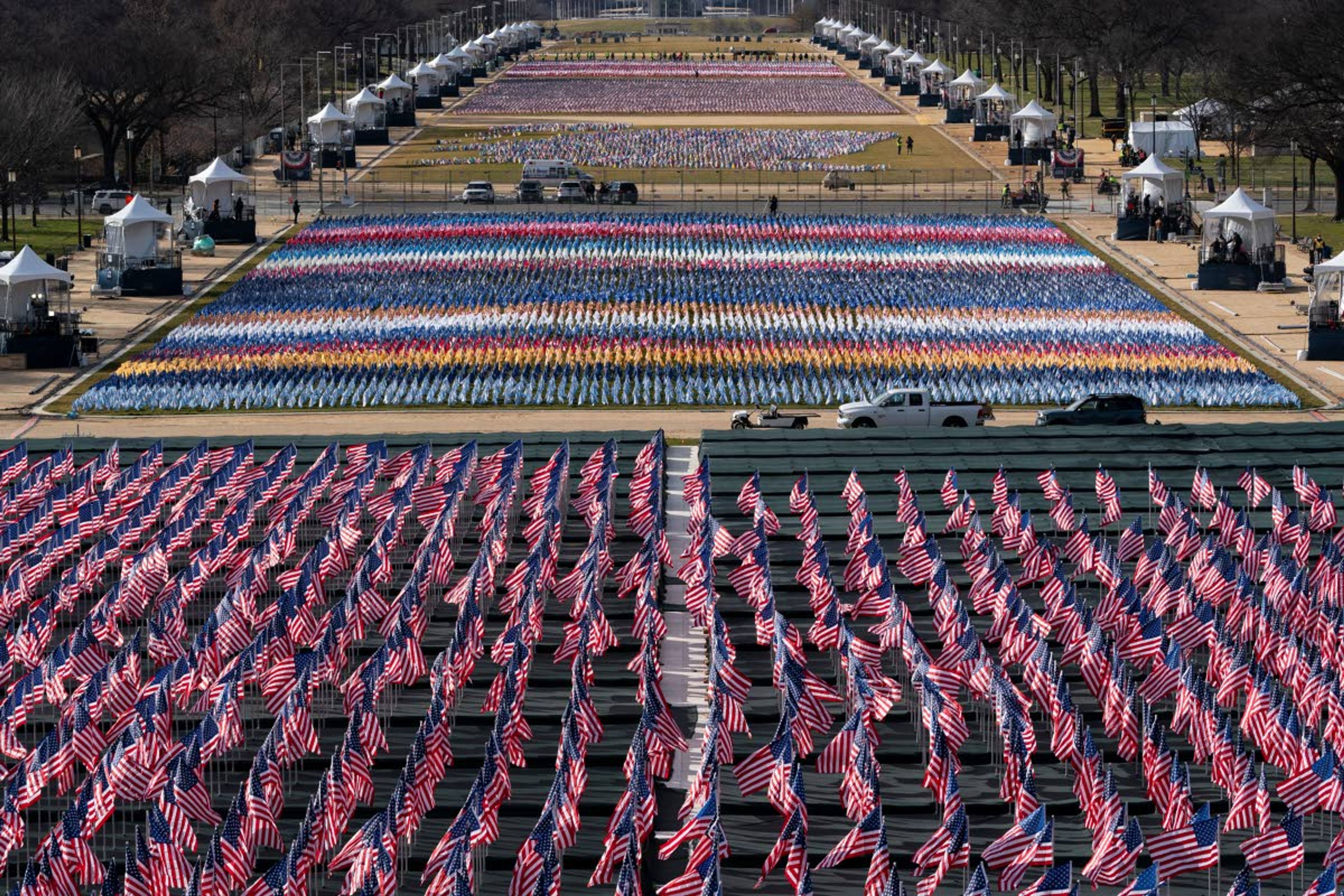 Flags are placed on the National Mall ahead of the inauguration of President-elect Joe Biden and Vice President-elect Kamala Harris, Monday, Jan. 18, 2021, in Washington. (AP Photo/Alex Brandon)