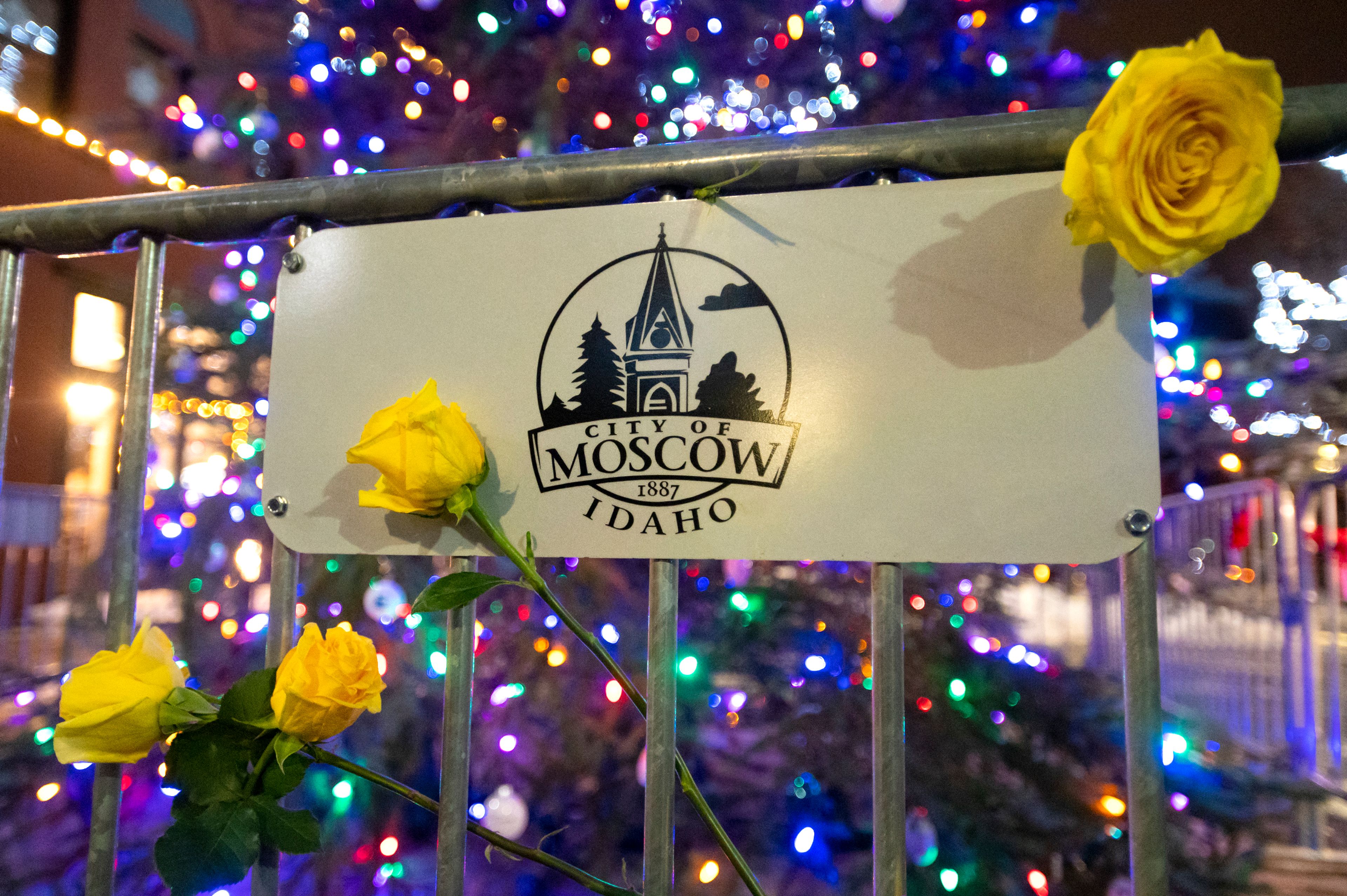 Yellow roses are placed around the Winter Wonderland Tree in Friendship Square in honor of Kaylee, Madison, Xana and Ethan.