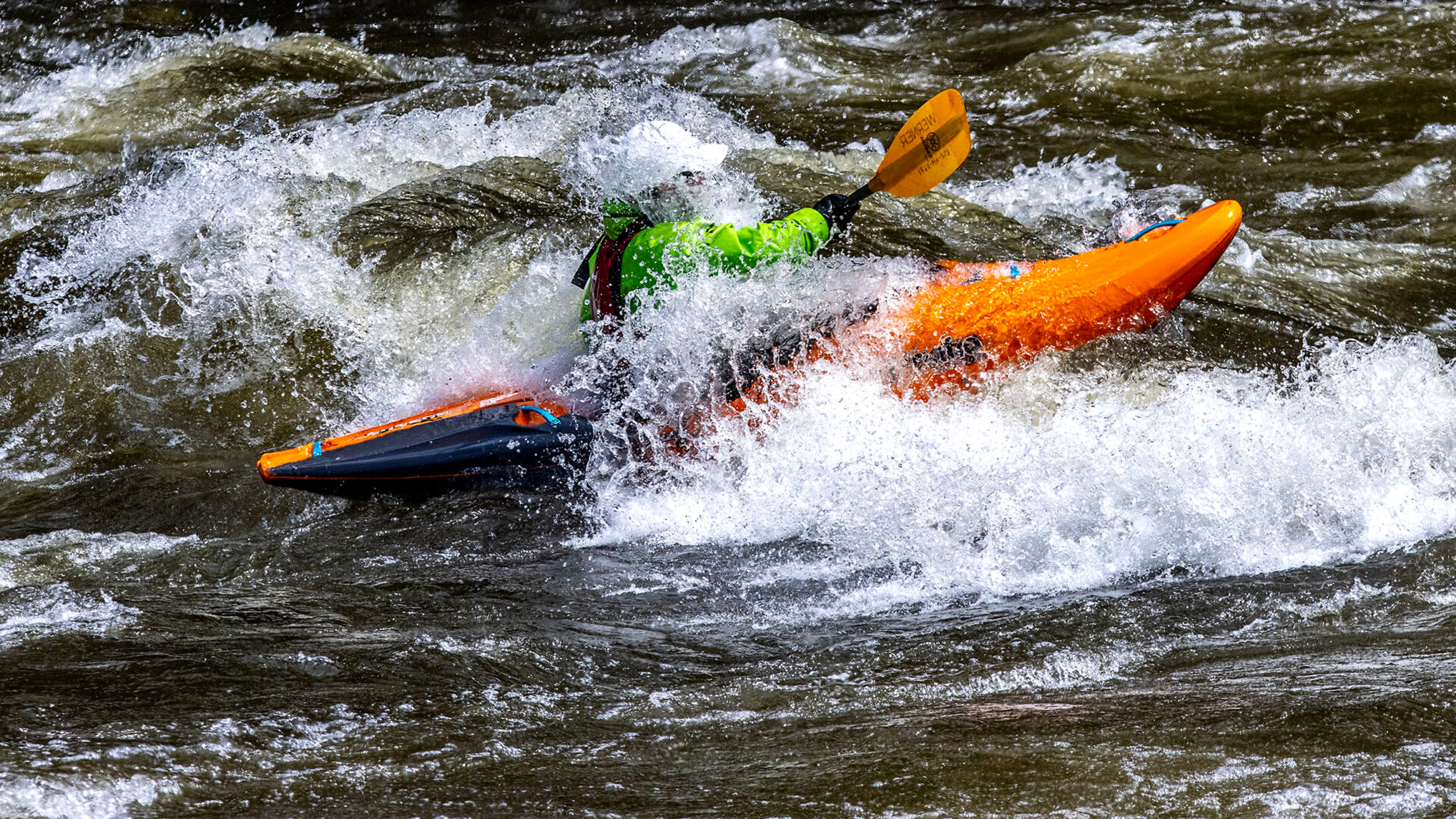 A kayaker hits rough rapids as he travels down the Lochsa River on Thursday, May 4.