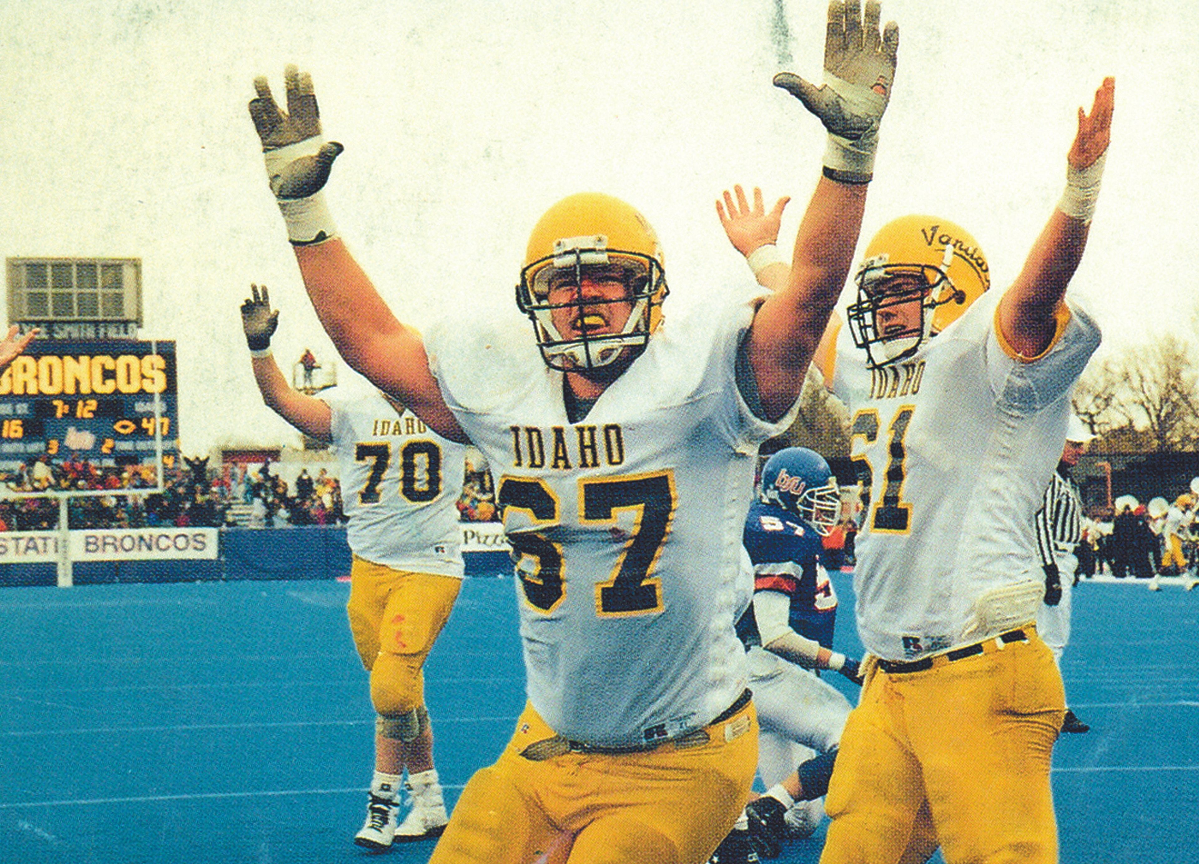 Idaho offensive lineman Jody Schnug (70), Jay Lukes (67) and Mat Groshong (61) celebrate during a blowout win at Boise State in 1992.