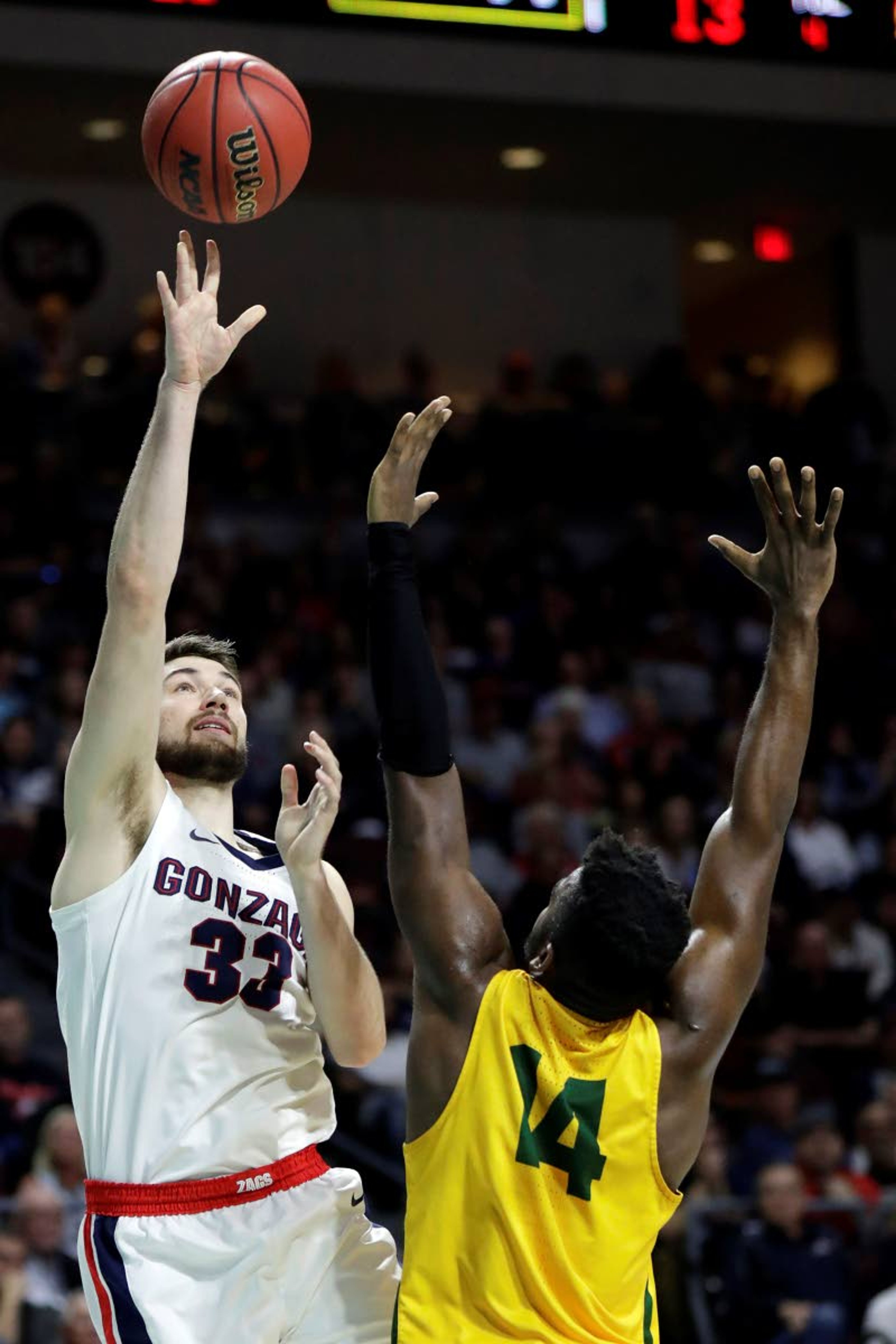 Gonzaga's Killian Tillie (33) shoots as San Francisco's Charles Minlend defends during the first half of an NCAA college basketball game in the West Coast Conference men's tournament Monday, March 9, 2020, in Las Vegas. (AP Photo/Isaac Brekken)