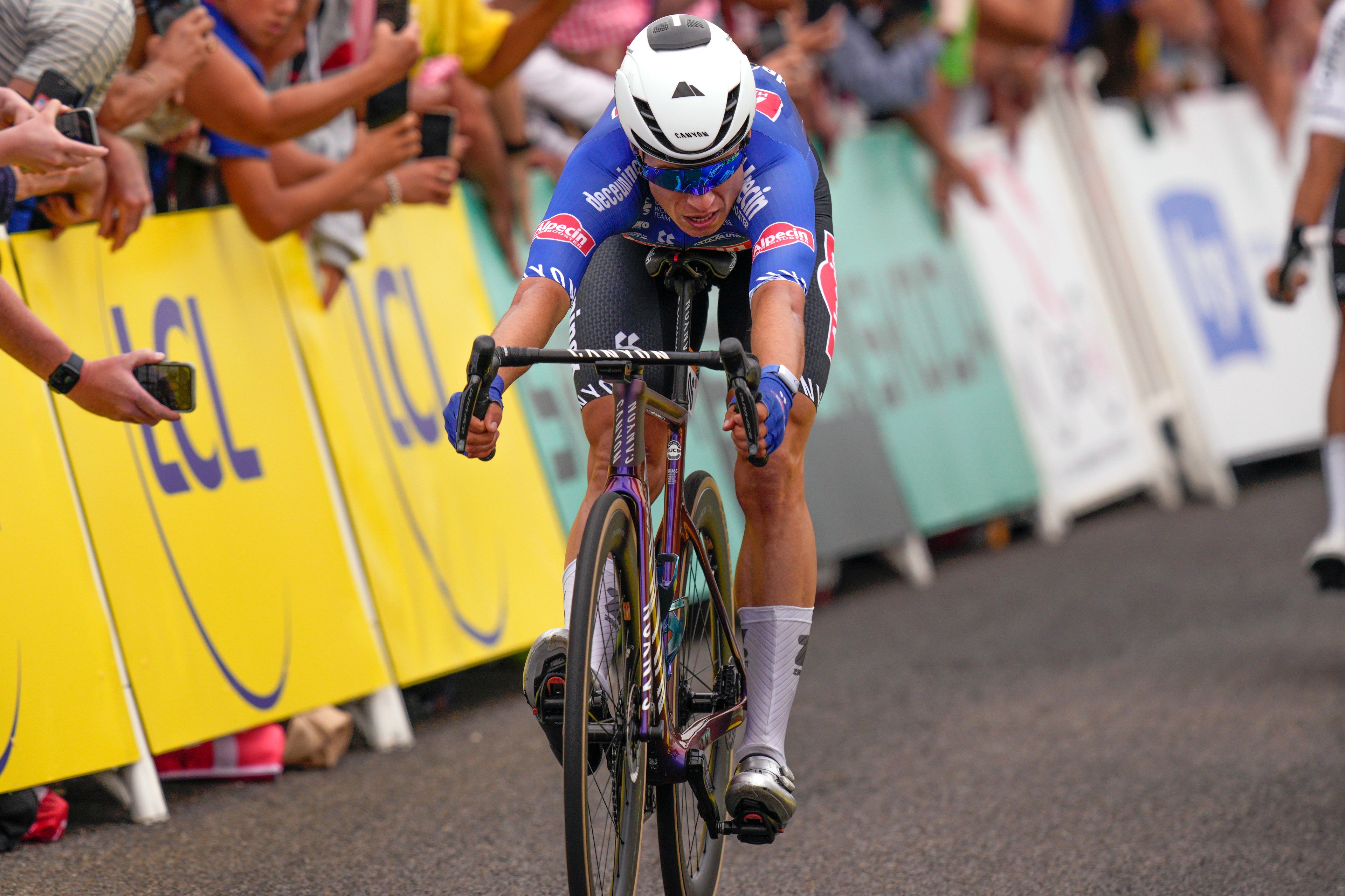 Belgium's Jasper Philipsen crosses the finish line to win the fourth stage of the Tour de France cycling race over 113 miles Tuesday withthe  start in Dax and finish in Nogaro, France.