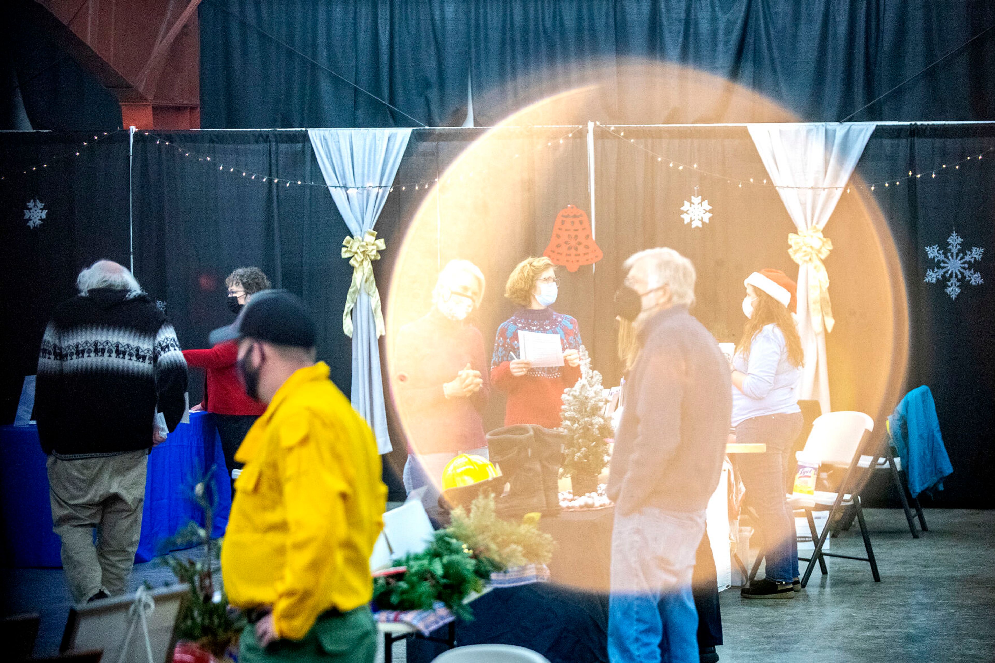 People talk with various non-profit organizations at the Alternative Giving Market in Moscow on Saturday.