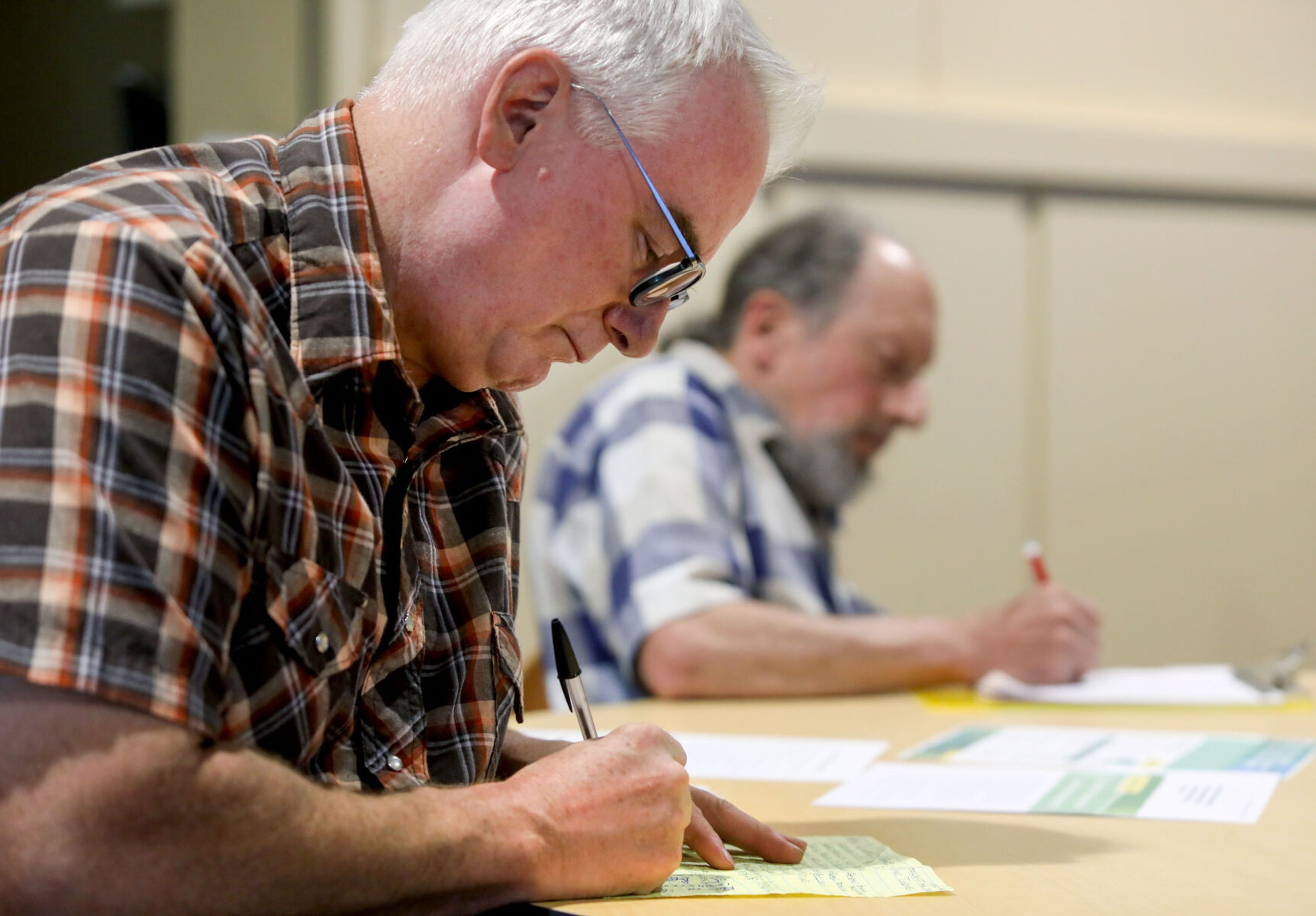 Kevin Akesson, from the Colfax area, takes notes during a public meeting for Save the Palouse on Thursday in Pullman.