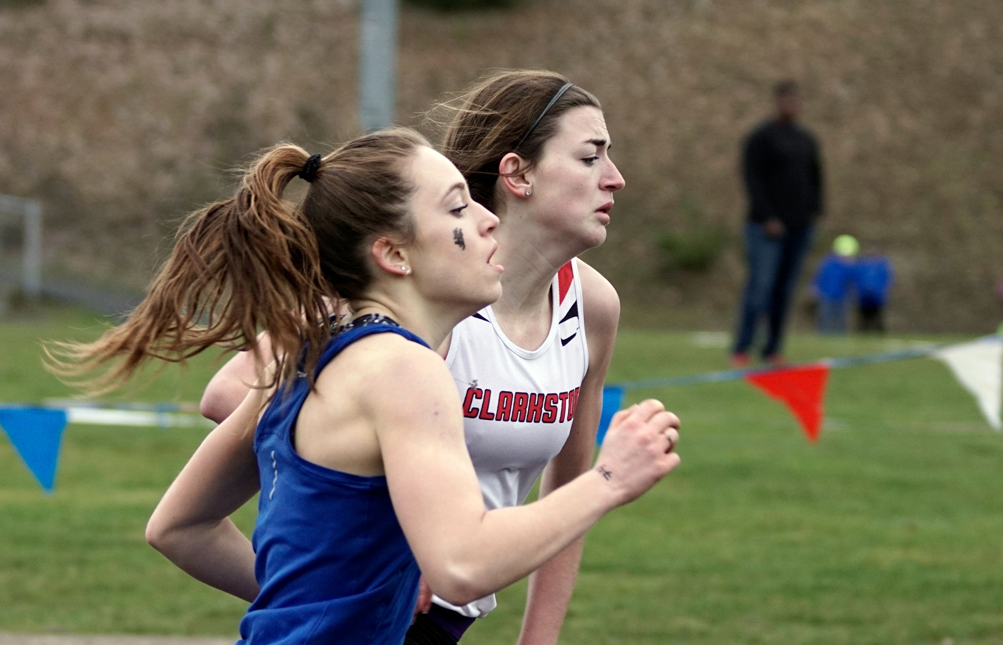 Pullman's Elyria Kabasenche, left, and Clarkston's Makinzie Packwood battle for the lead near the finish of the 400 meter sprint during a dual meet at Pullman Wednesday. Kabesenche, who is the state 2A cross country champion edged Packwood by a tenth of a second, finishing with a time of 1:02.5.