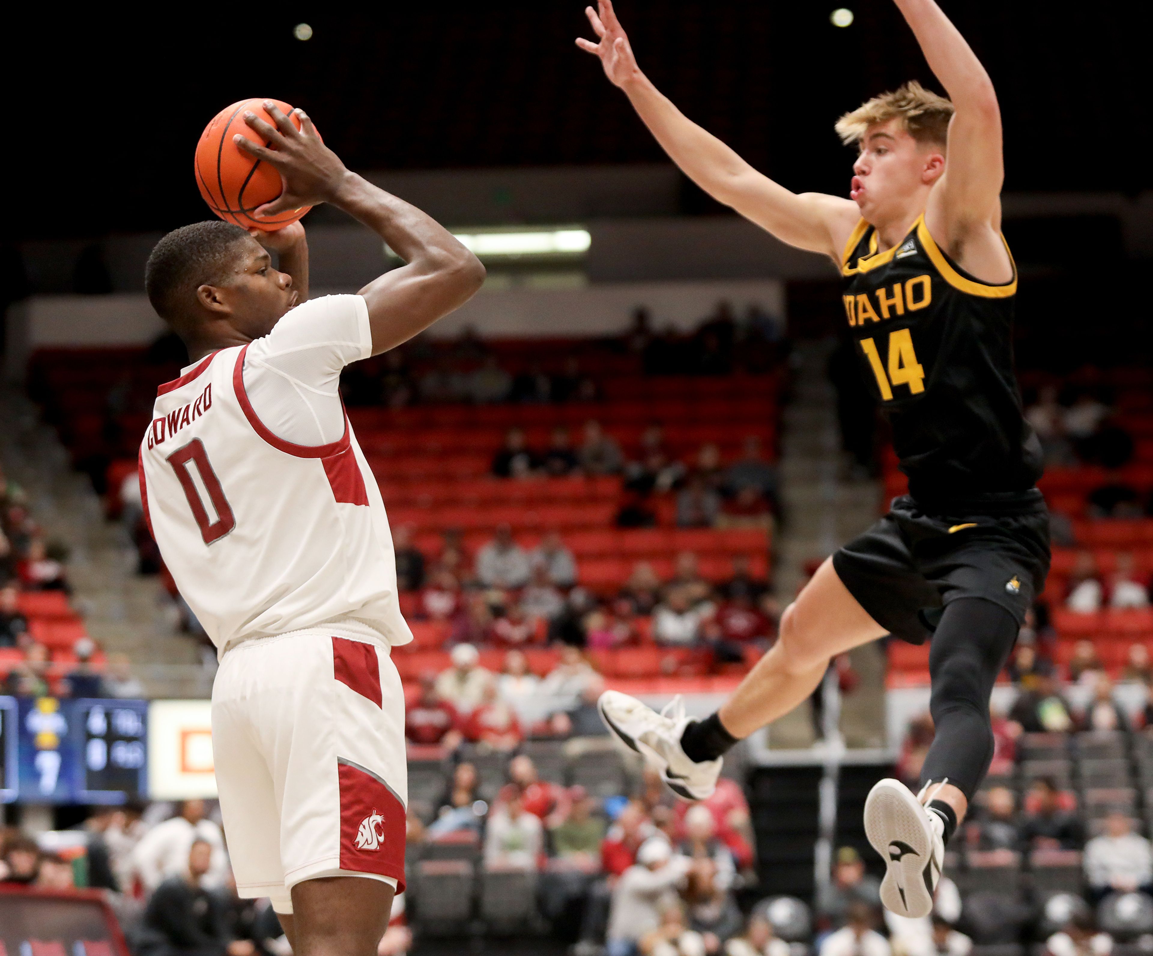 Washington State guard Cedric Coward is guarded by Idaho guard Kolton Mitchell during the Battle of the Palouse game at Beasley Coliseum in Pullman.