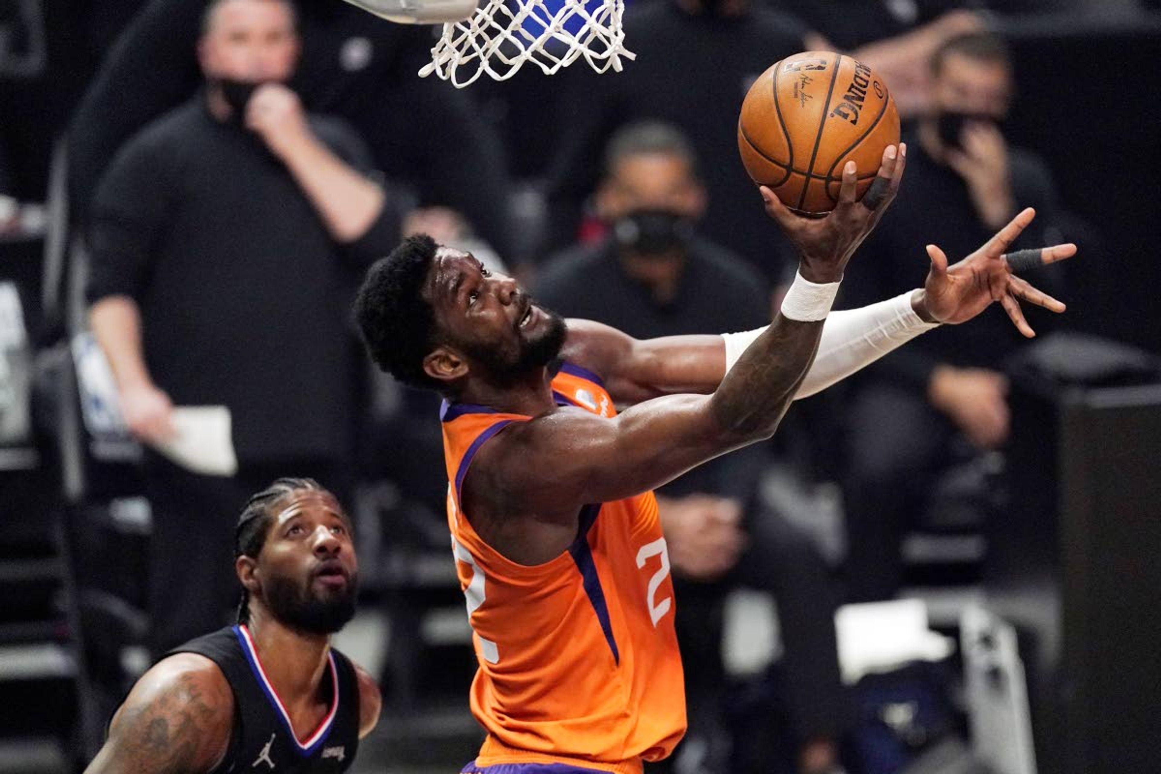 Phoenix Suns center Deandre Ayton, right, shoots as Los Angeles Clippers guard Paul George defends during the first half in Game 6 of the NBA basketball Western Conference Finals Wednesday, June 30, 2021, in Los Angeles. (AP Photo/Mark J. Terrill)