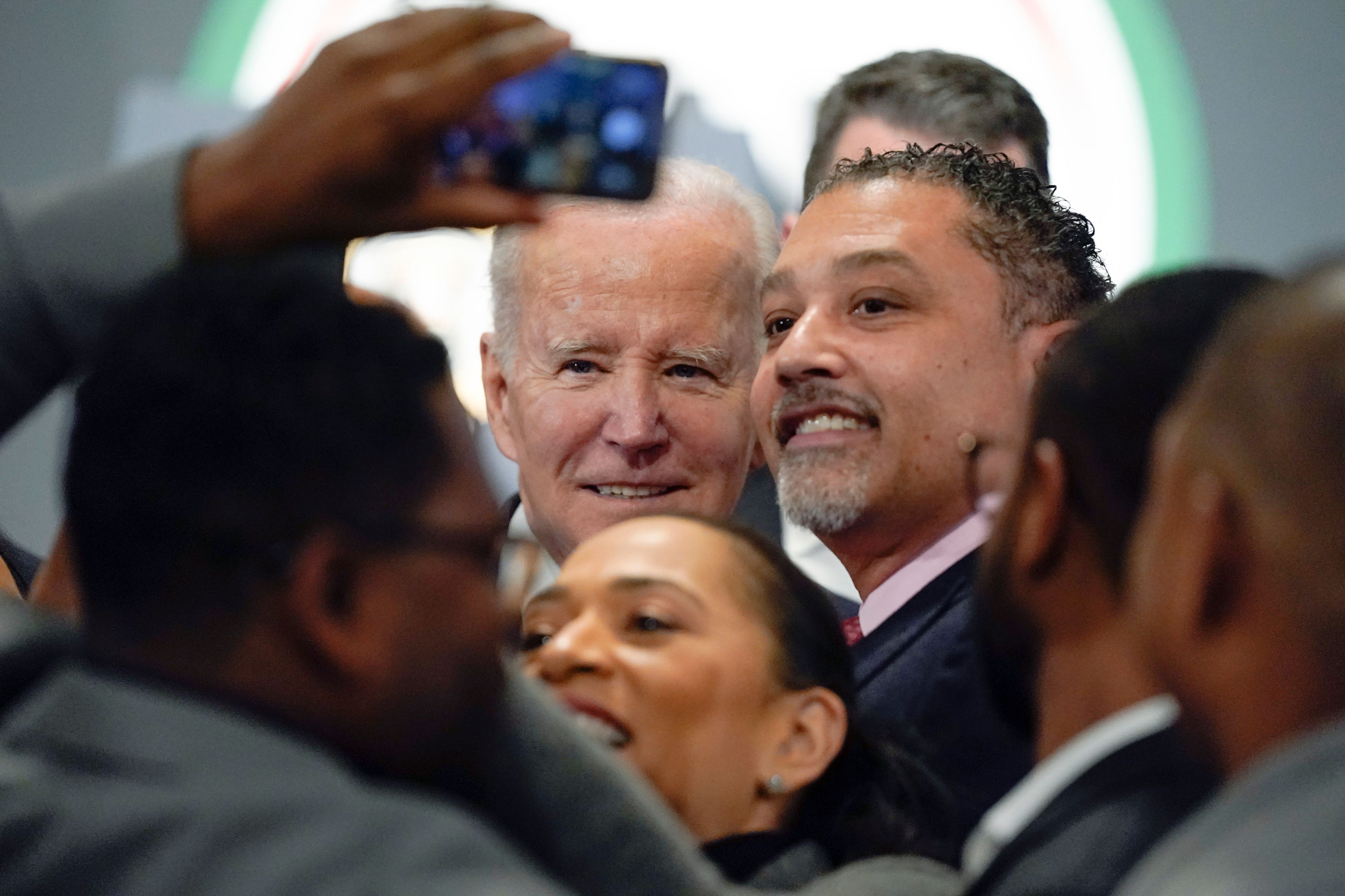 President Joe Biden poses for photos after speaking at the National Action Network's Martin Luther King, Jr., Day breakfast, Monday, Jan. 16, 2023, in Washington. (AP Photo/Manuel Balce Ceneta)