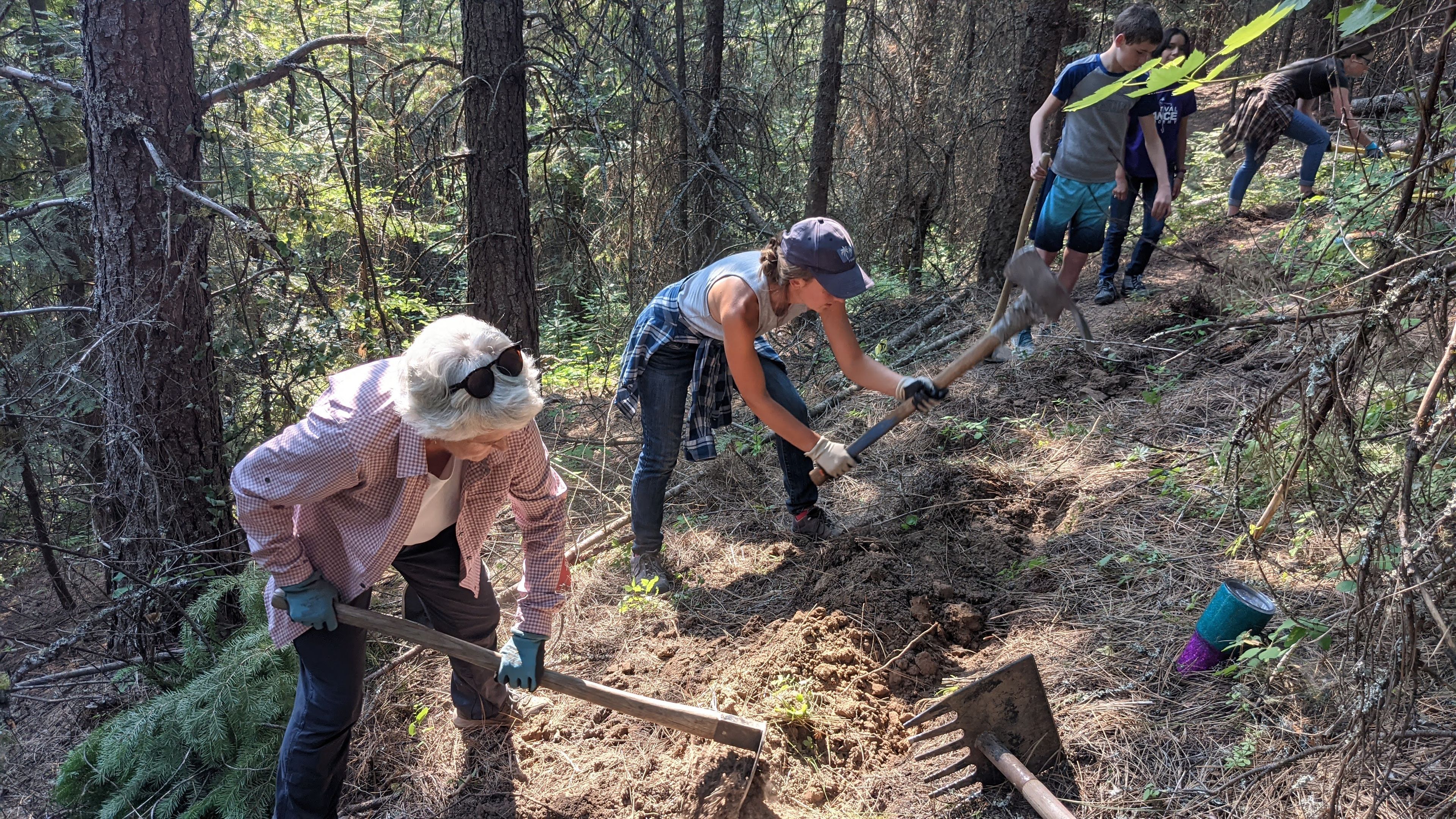 Volunteers help construct Judy’s Trail, a 1.2-mile path in Troy, named after land contributor Judy LaLonde, to help give the community more ways to get into nature. Photo provided by Lovina Englund