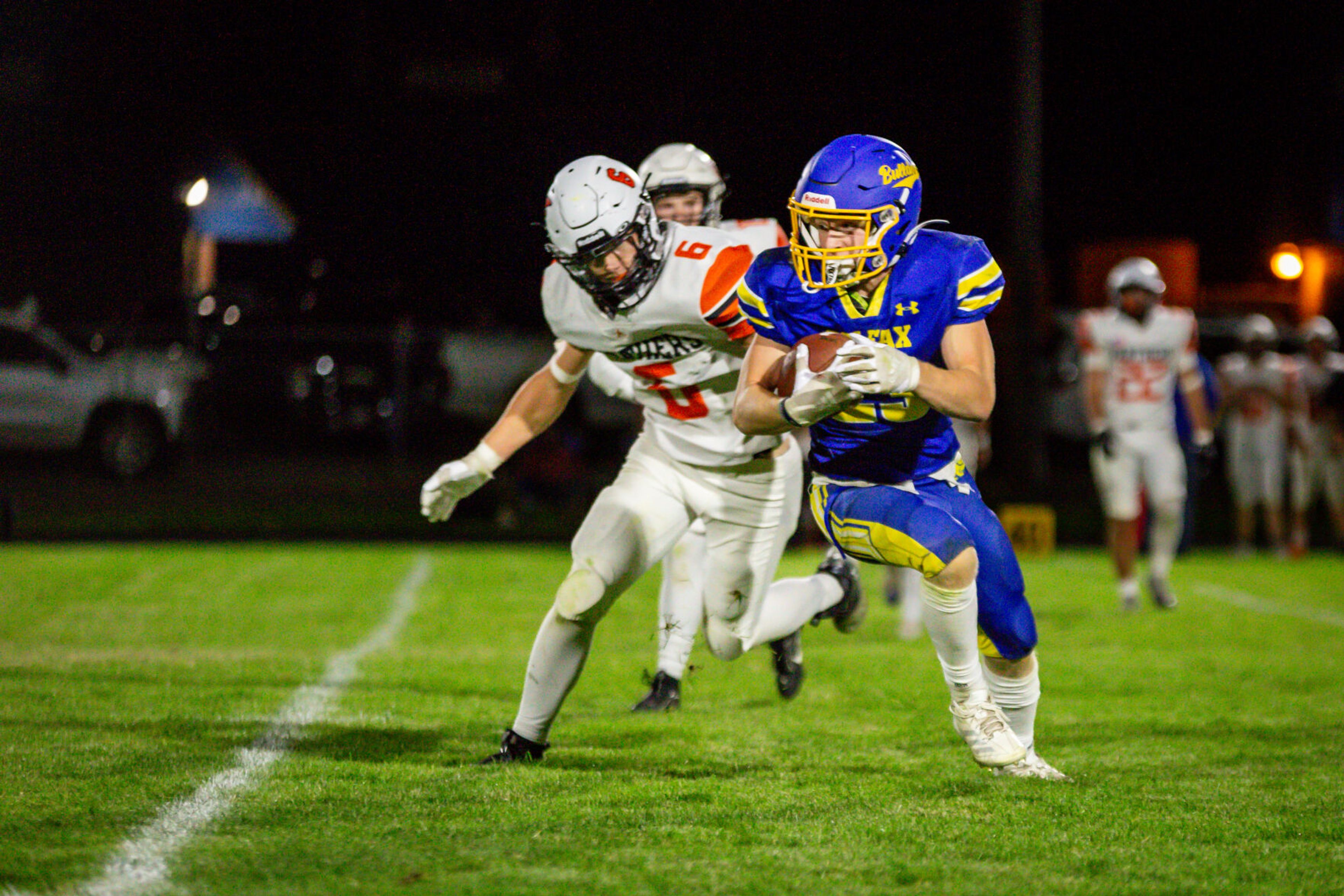 Colfax senior Zach Cooper looks upfield after making a catch during a game against Asotin on Friday, Sept. 20, in Colfax.