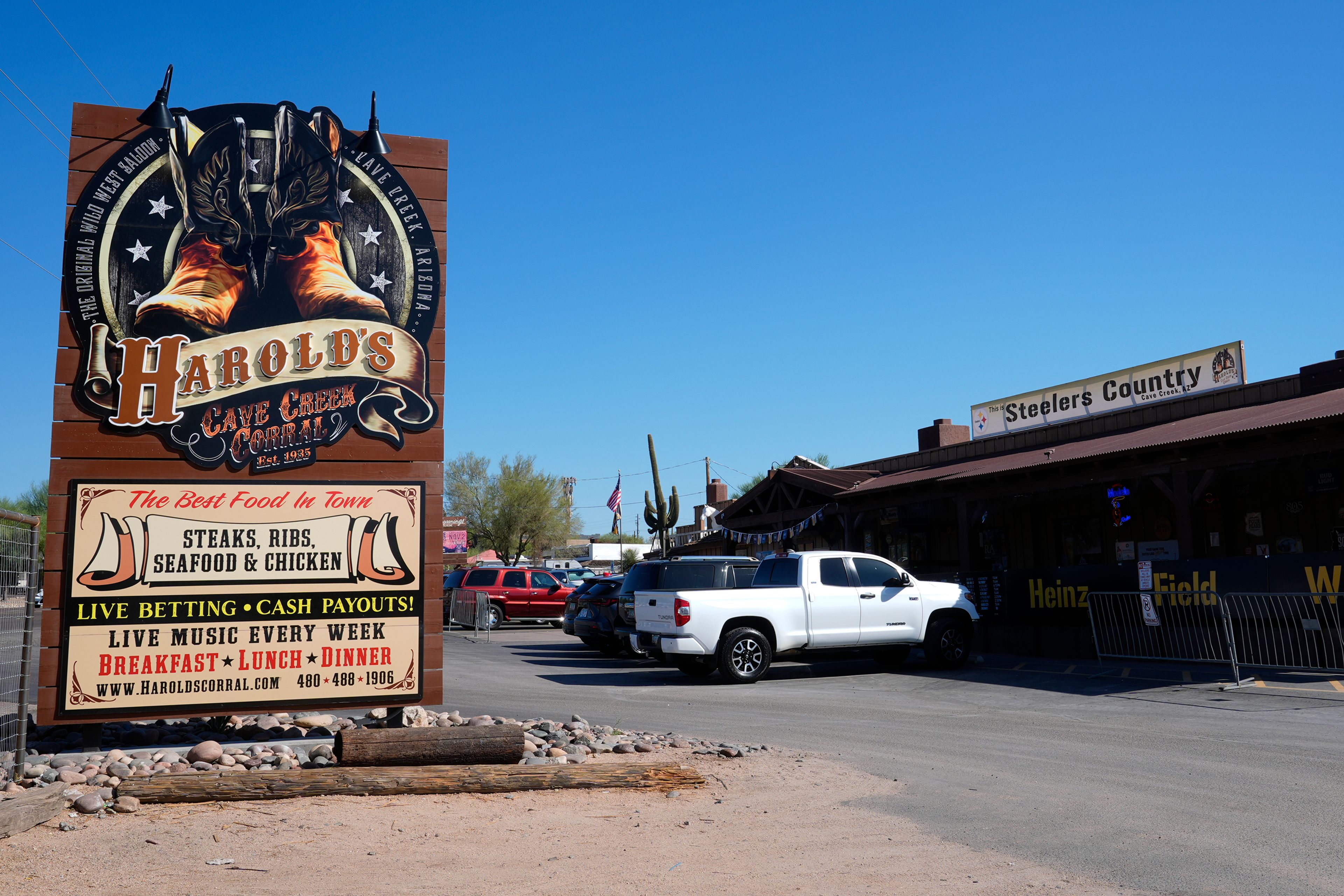 The front entrance of Harold's Cave Creek Corral, regarding Arizona Prop 138 on minimum wage Thursday, Oct. 3, 2024, in Cave Creek, Ariz. (AP Photo/Ross D. Franklin)