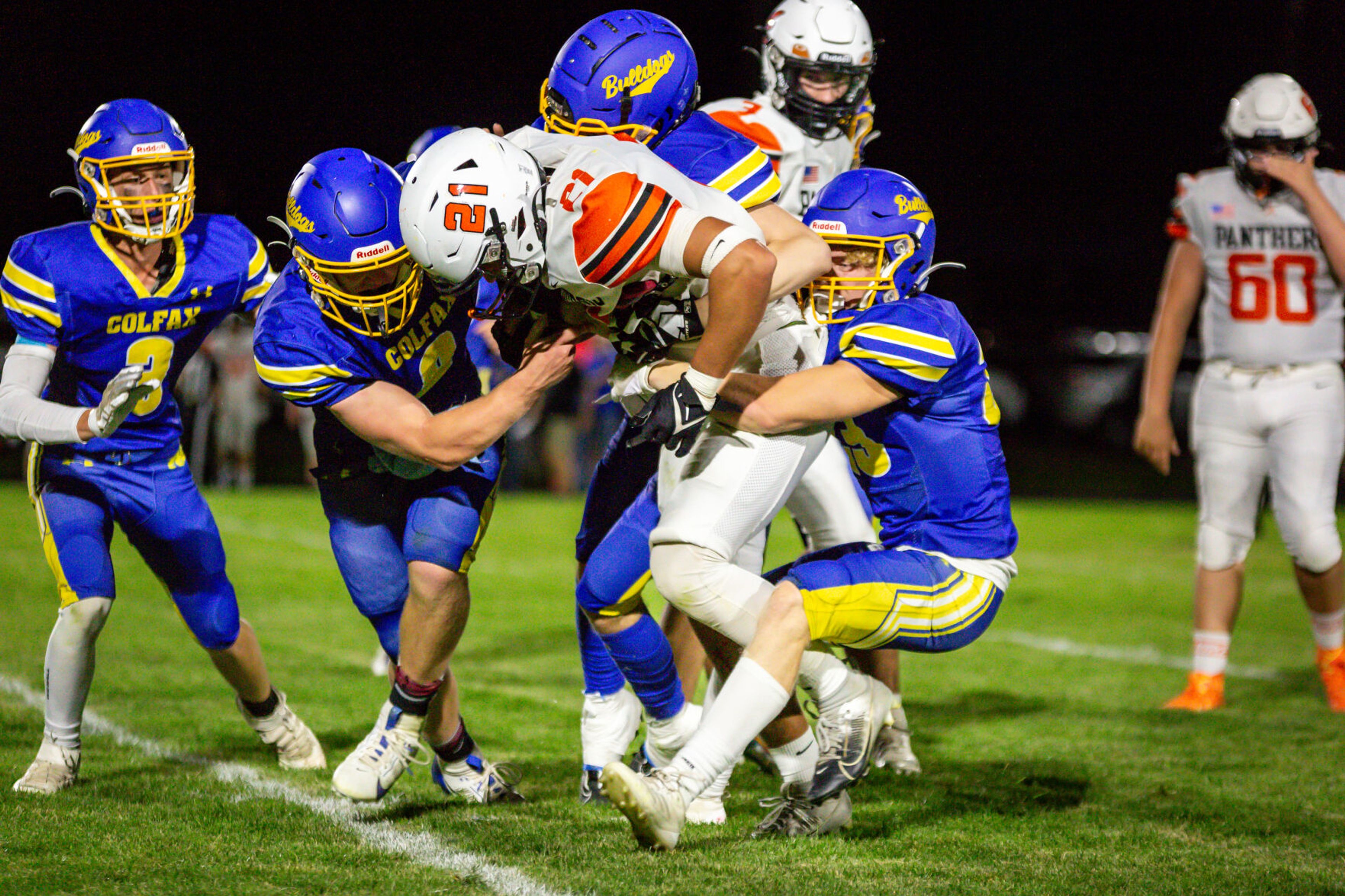 Asotin senior running back Peter Eggleston (21) fights for more yards during a game Friday, Sept. 20, in Colfax.