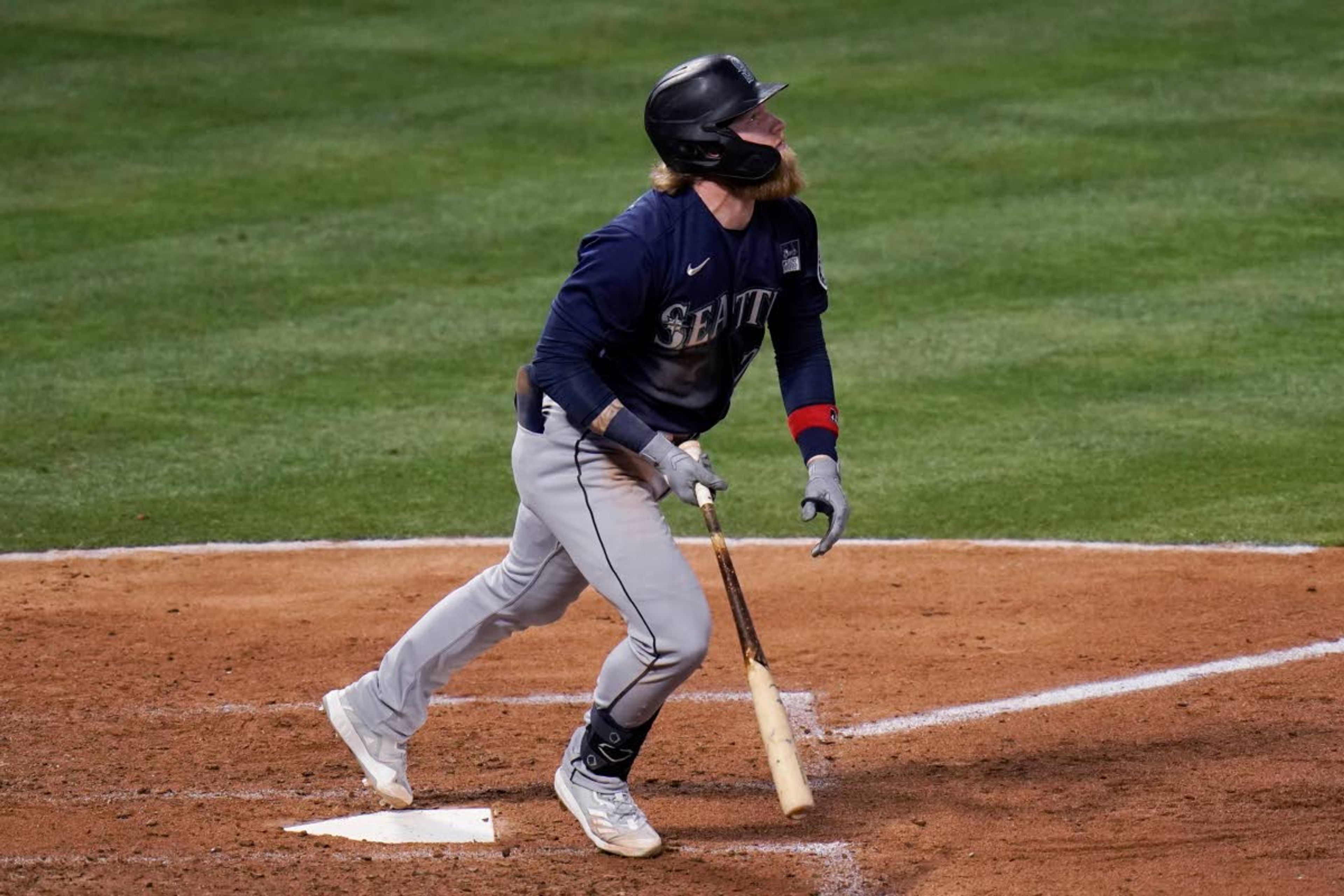 Associated PressMariners’ Jake Fraley watches his three-run home run during the fourth inning against the Angels on Thursday in Anaheim, Calif.