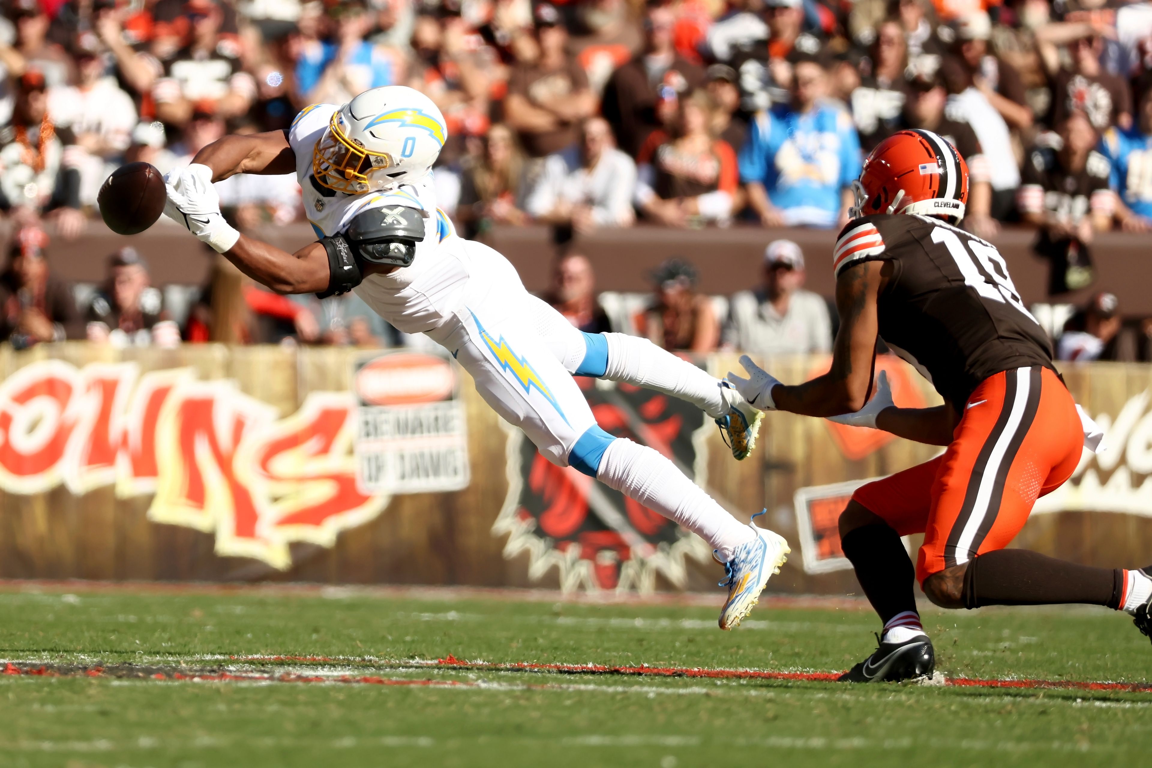 Los Angeles Chargers linebacker Daiyan Henley (0) attempts to intercept a pass during an NFL football game against the Cleveland Browns, Sunday, Nov. 3, 2024, in Cleveland. (AP Photo/Kirk Irwin)