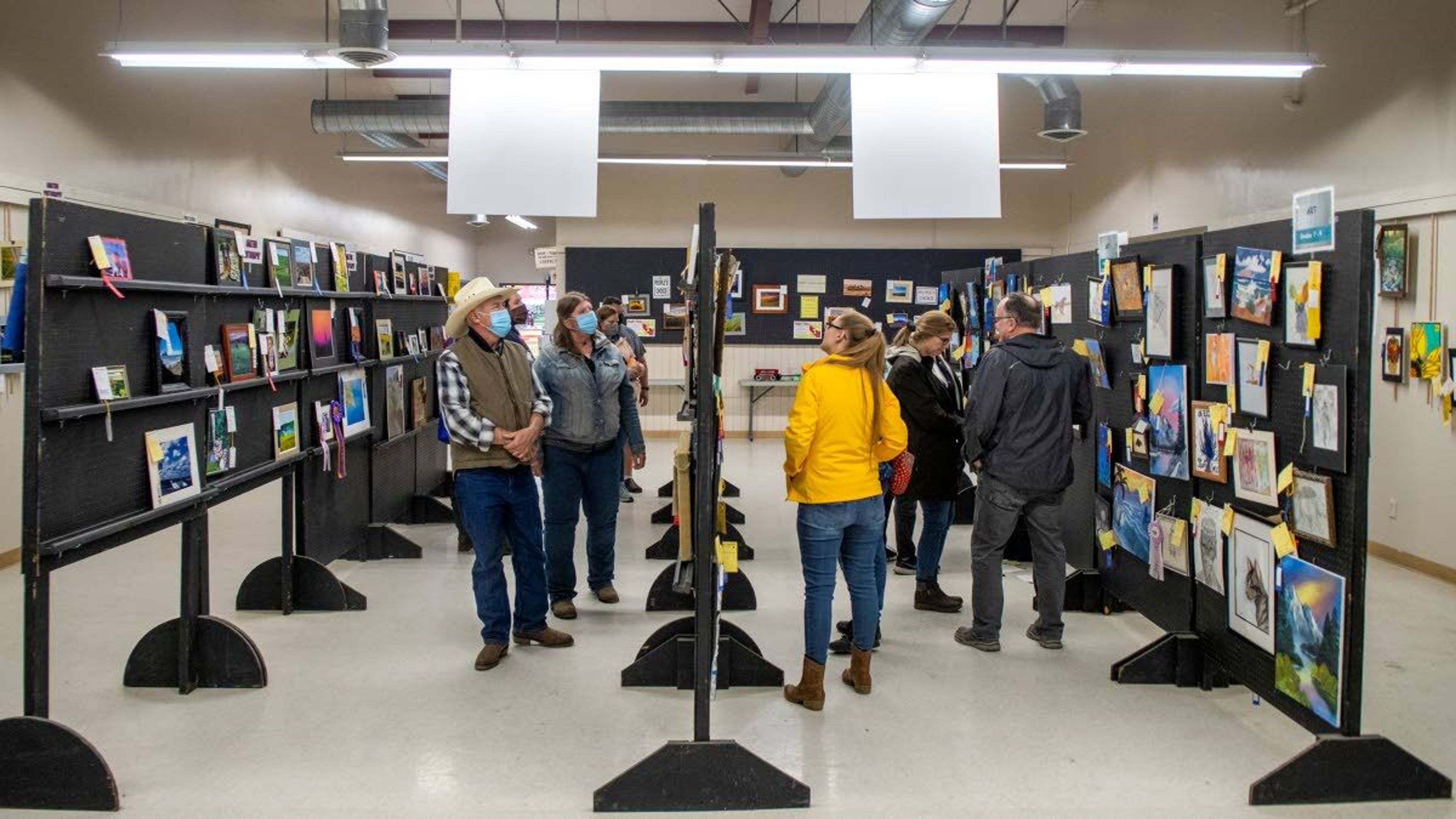 Visitors view entires into the photography contest at the Latah County Fair on Saturday morning in Moscow.