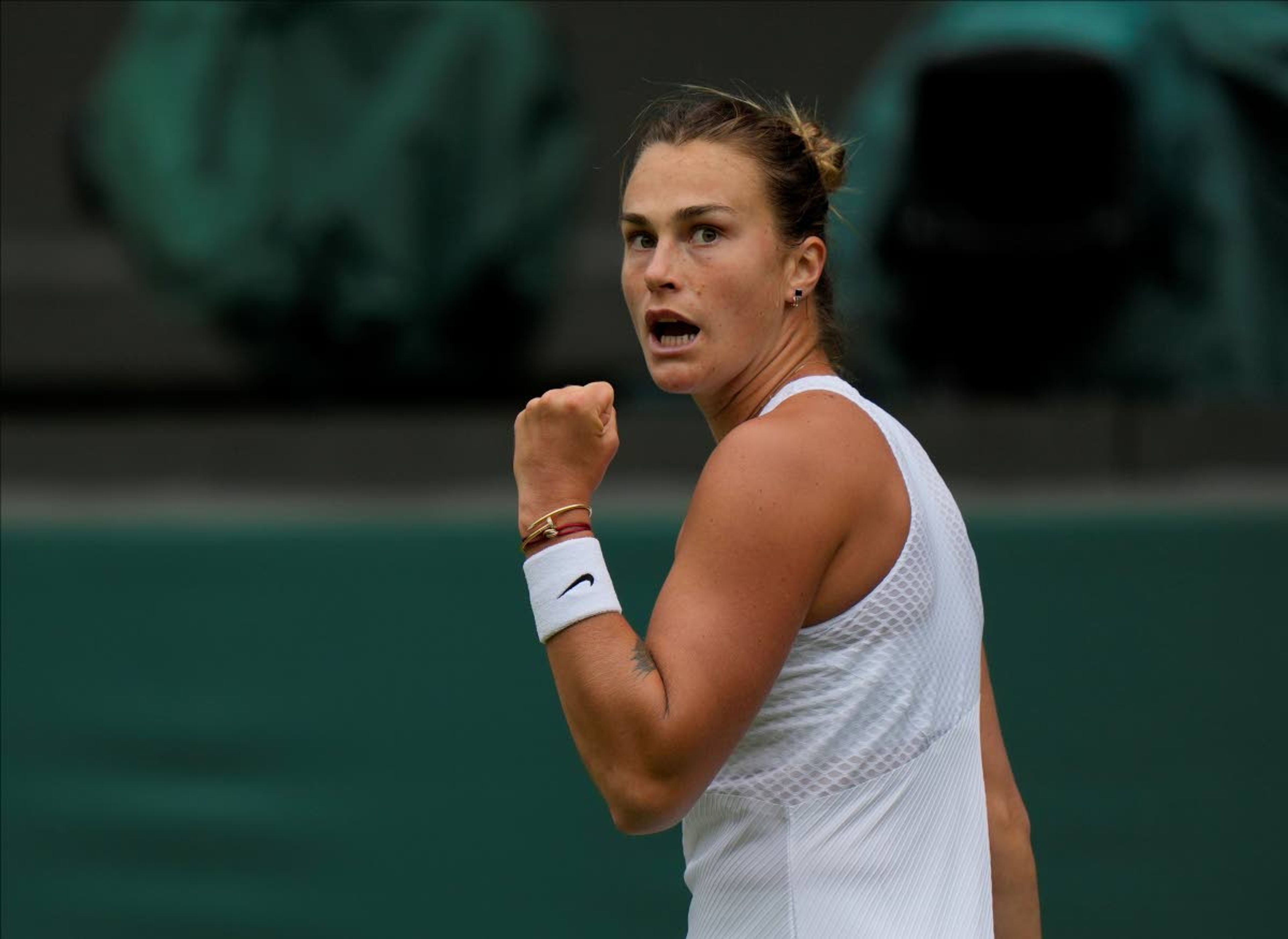 Belarus's Aryna Sabalenka celebrates winning a point against Britain's Katie Boulter during the women's singles second round match on day three of the Wimbledon Tennis Championships in London, Wednesday June 30, 2021. (AP Photo/Alastair Grant)