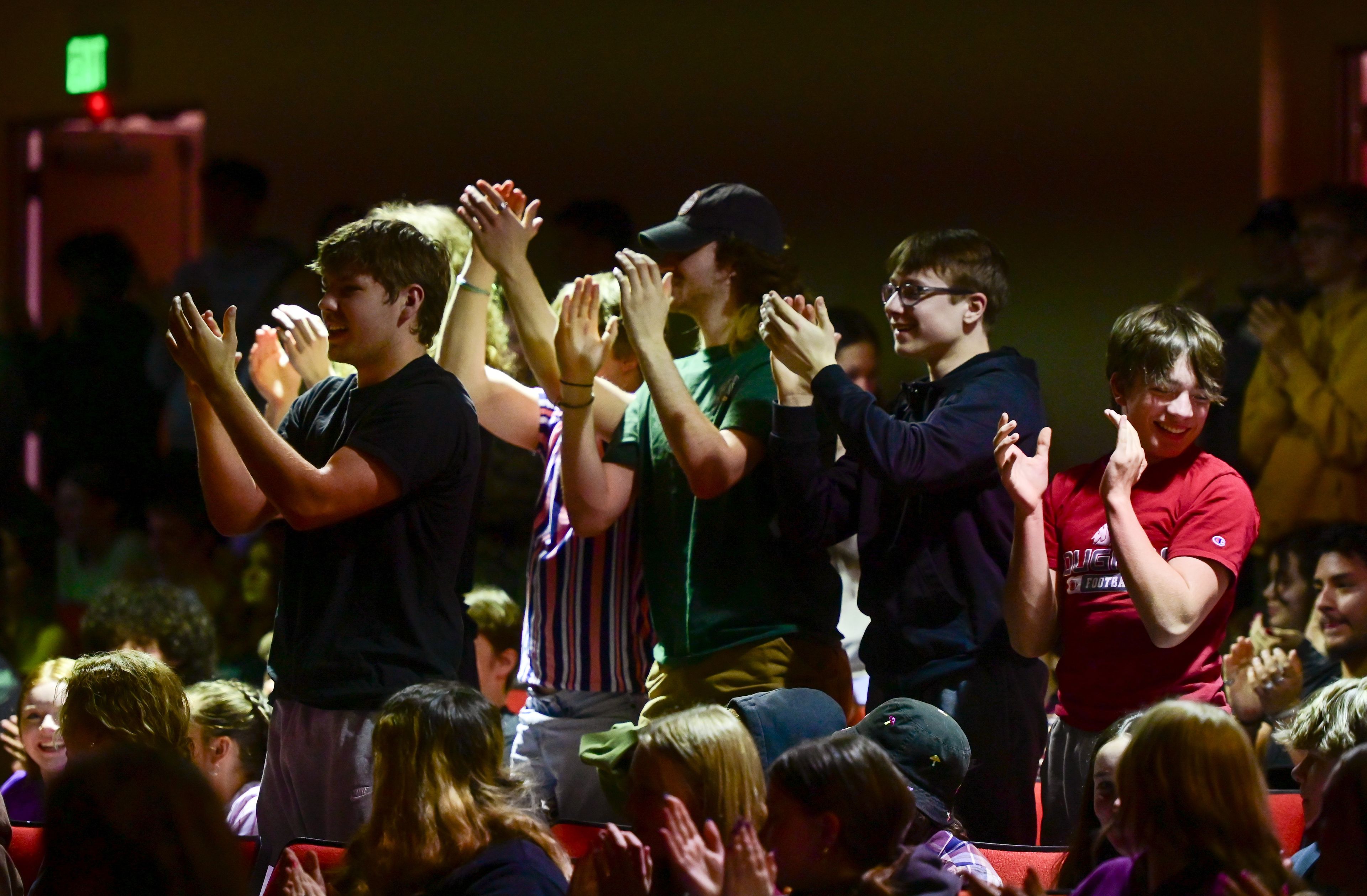 Students stand to clap for Charles Pan after his Arts Fest performance at Moscow High School on Wednesday.