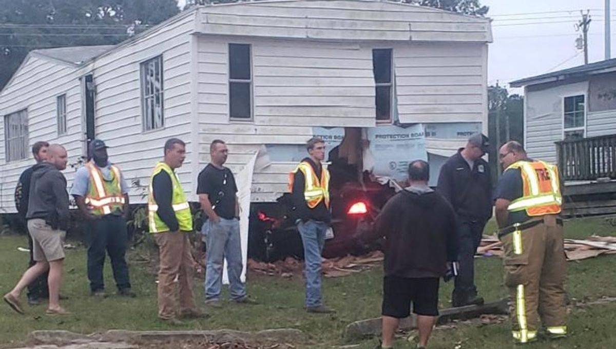 Driver charged with DWI after crashing into trailer