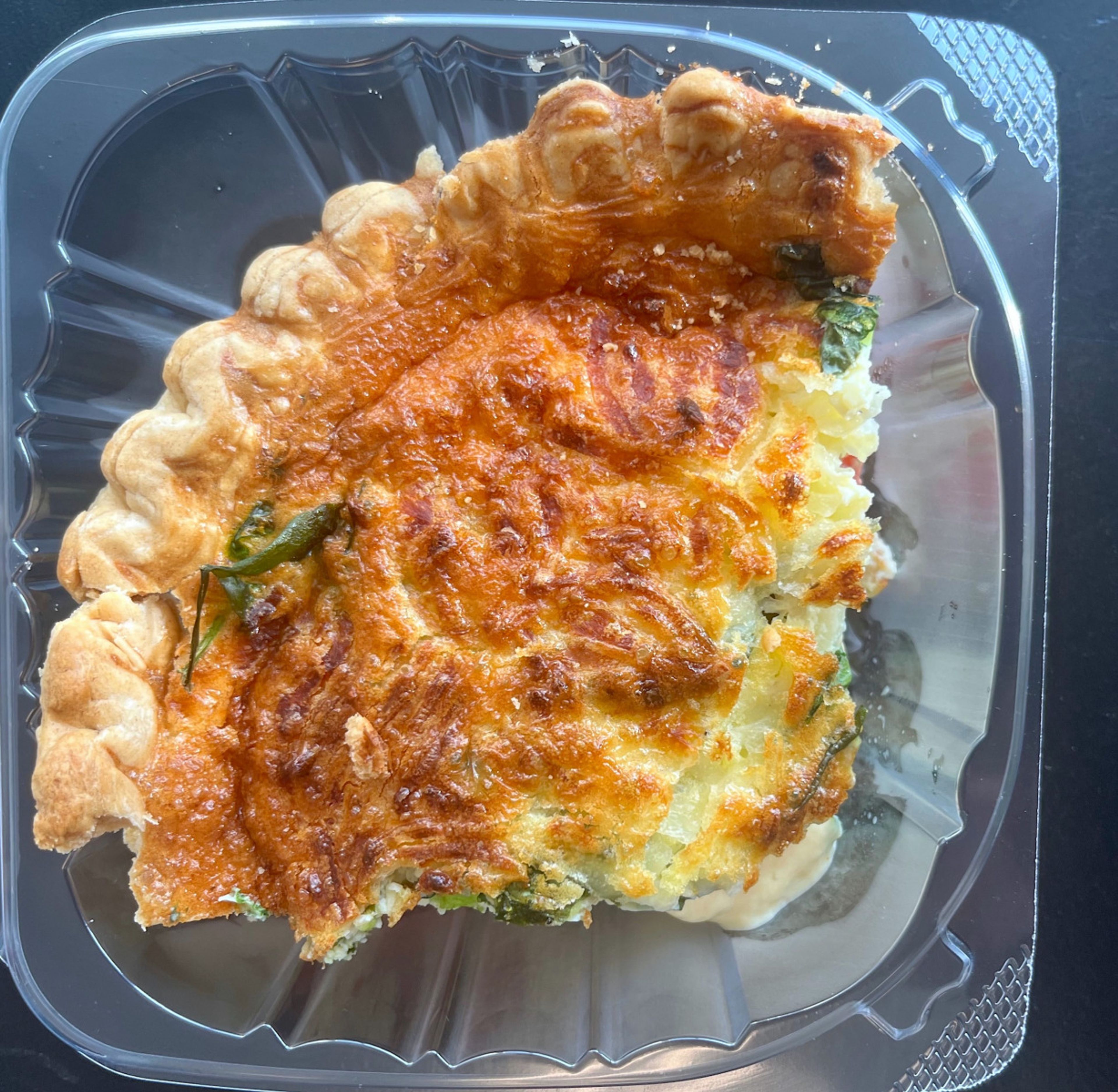 A tomato, spinach and mozzarella quiche is shown at Essential Edibles in downtown Spring Hope. Hannah Whitley Camarena | Enterprise