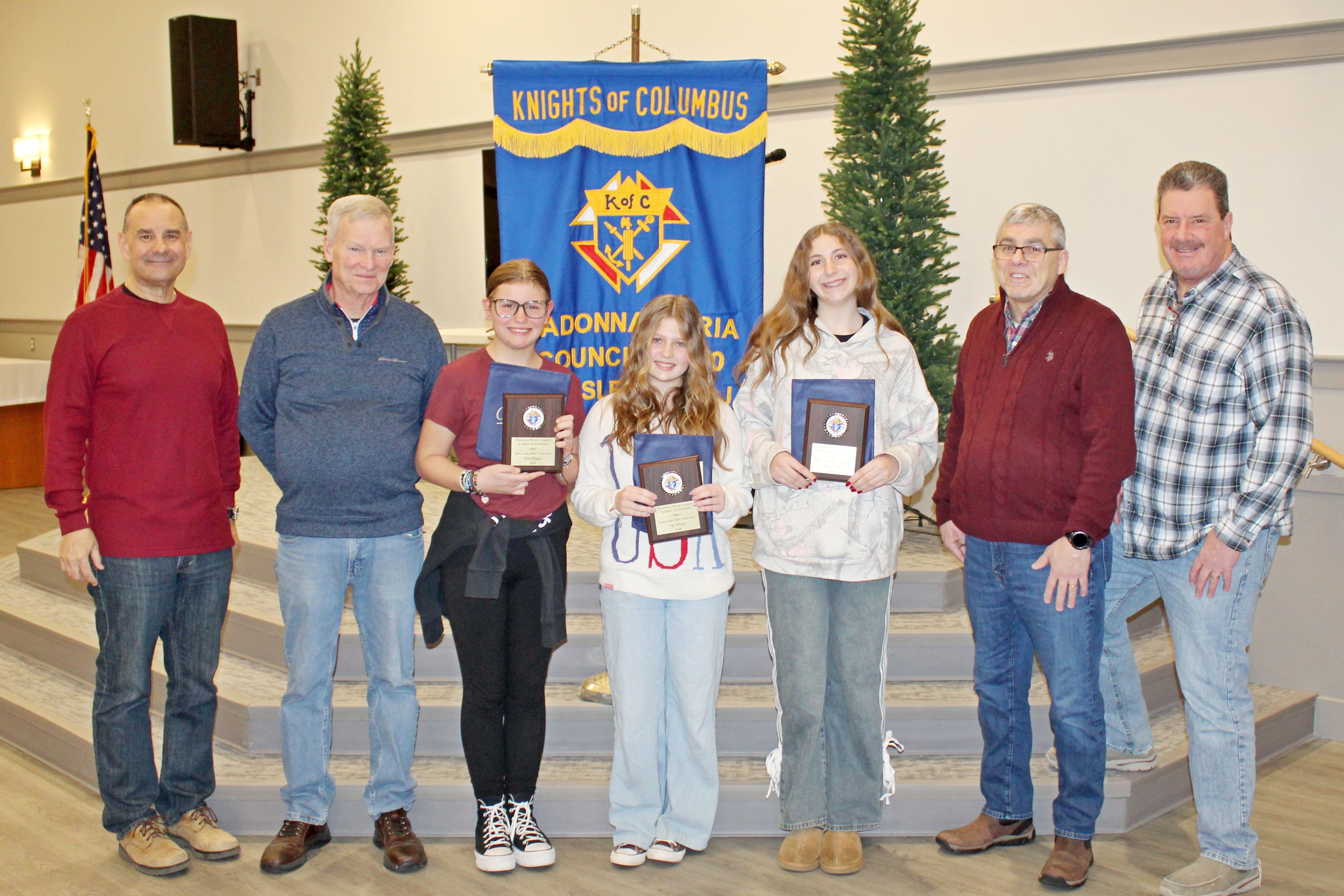 Three eighth grade students won the annual Spelling Bee hosted by Sea Isle City’s Saint Joseph Church Knights of Columbus on February 26.  The winners are shown with the event’s hosts during the awards ceremony (from left): Spelling Bee moderator, Michael Jargowsky; Judge Jim McGowan; Torri Bucci (13, Ocean View) second place winner; Layla Mitchell (14, Ocean View) first place winner; Riley Reich (14, Seaville) third place winner; Judge Alex Iannone; and Judge Ron Custer. 