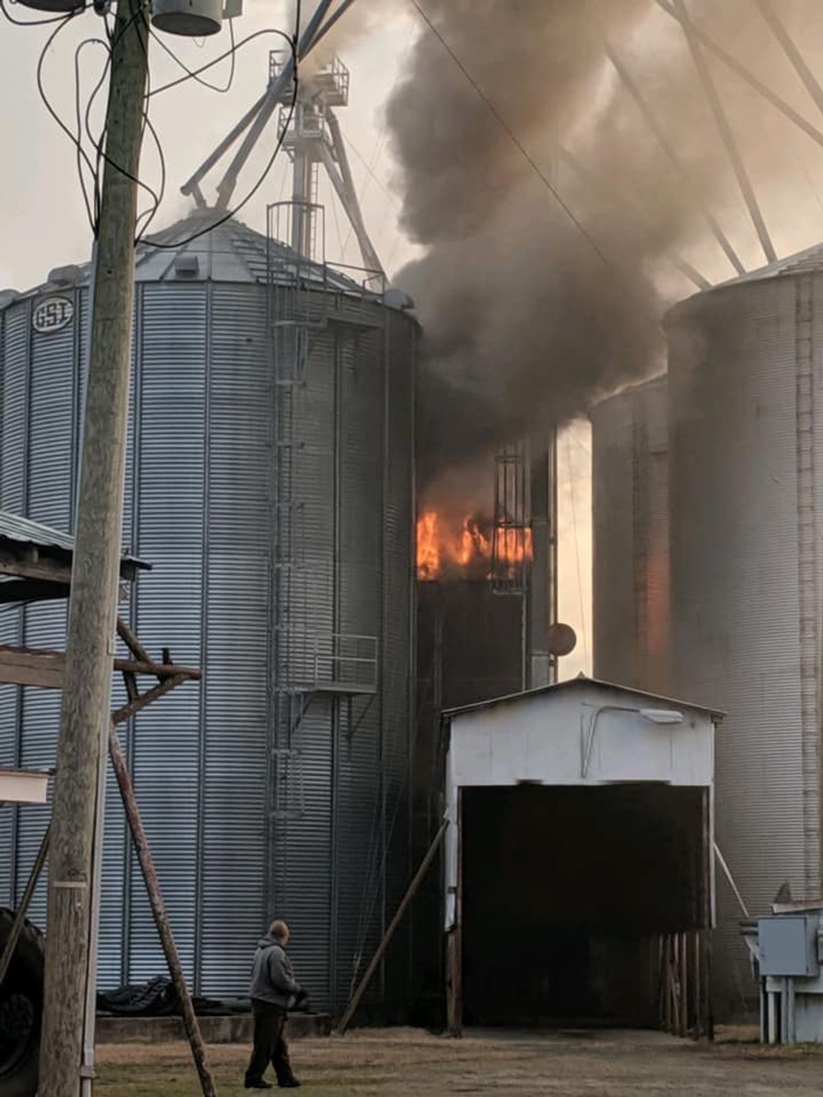 Firefighters extinguish grain silo fire