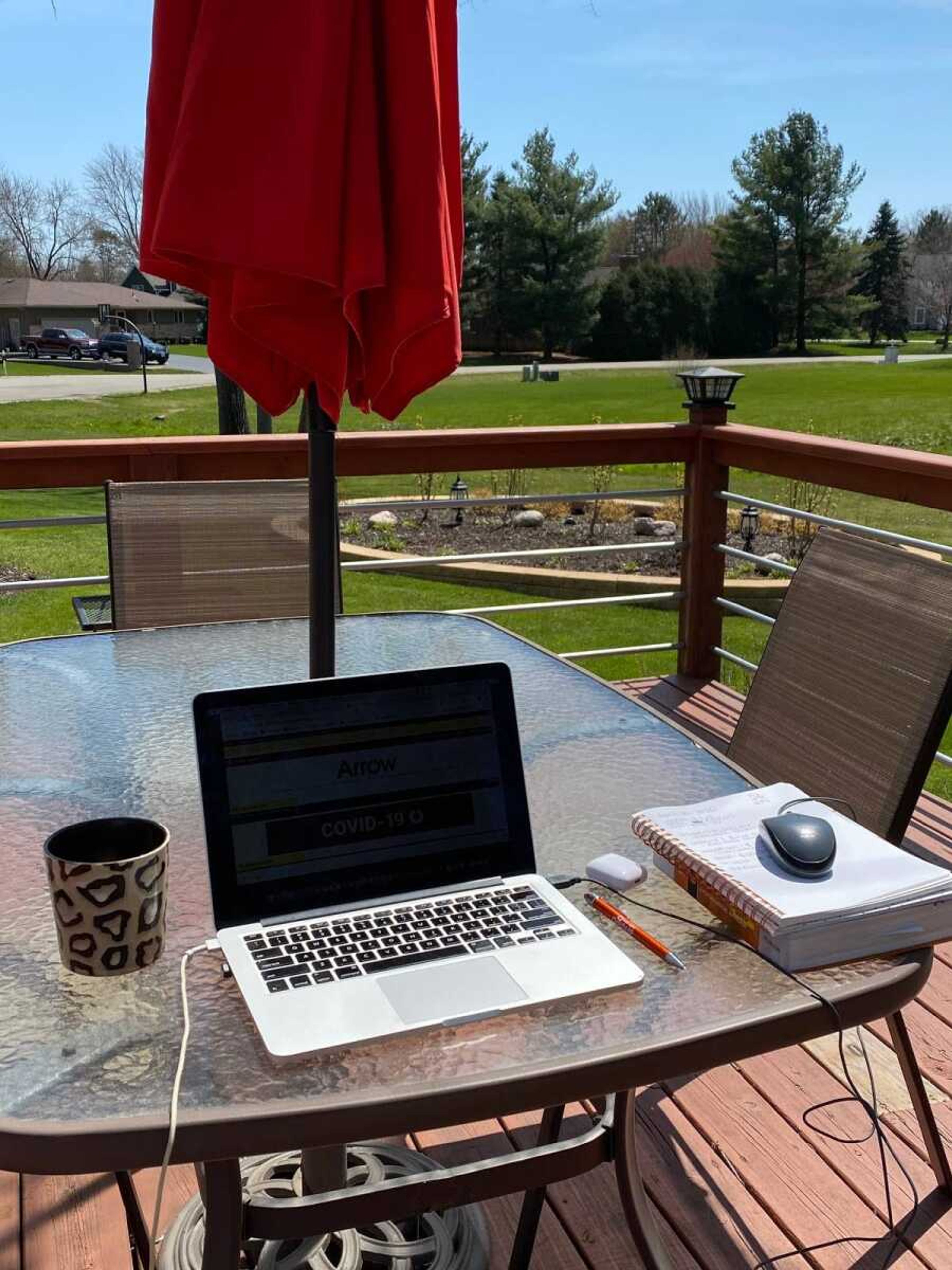 Samantha Wakitsch works from the back porch on Monday, April 20 in Johnsburg, Illinois.