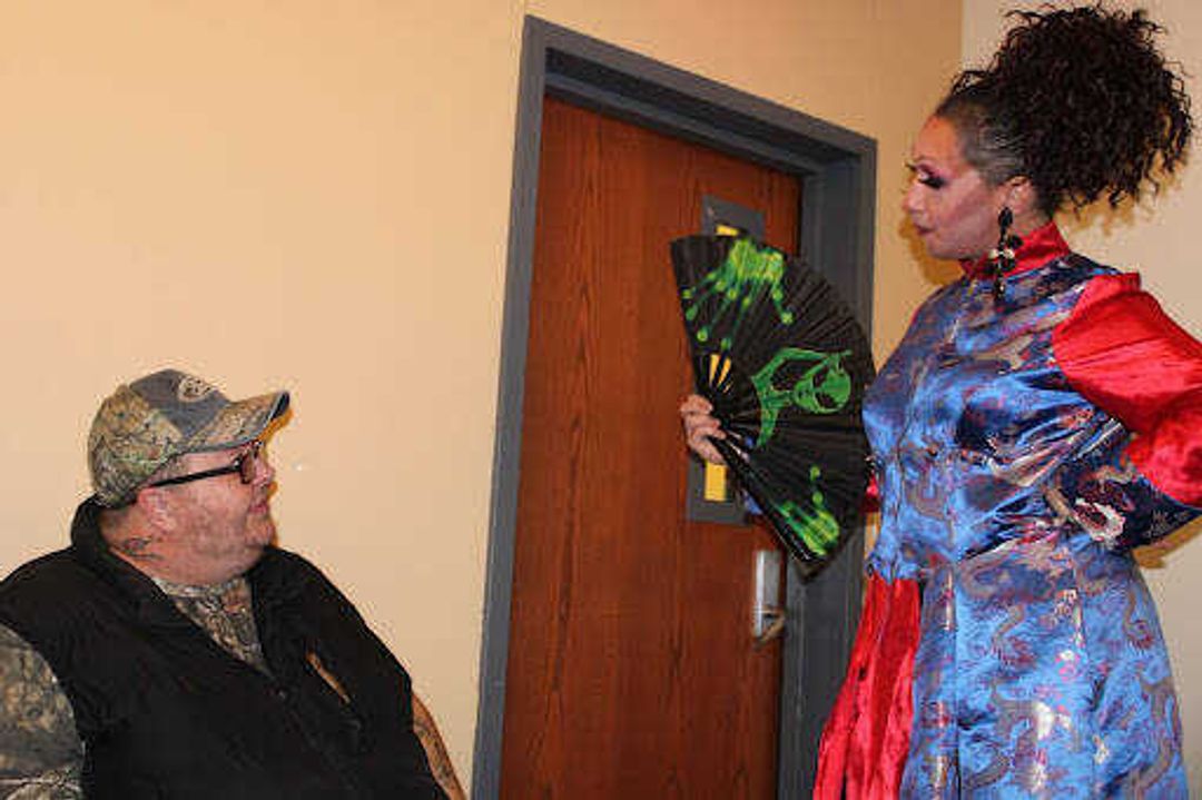 Sasha Moore and Naomi Price talk before the show in a dressing room below Shuck Recital Hall. Although Moore is not on the performance list, they still advise many of the queens before the production.