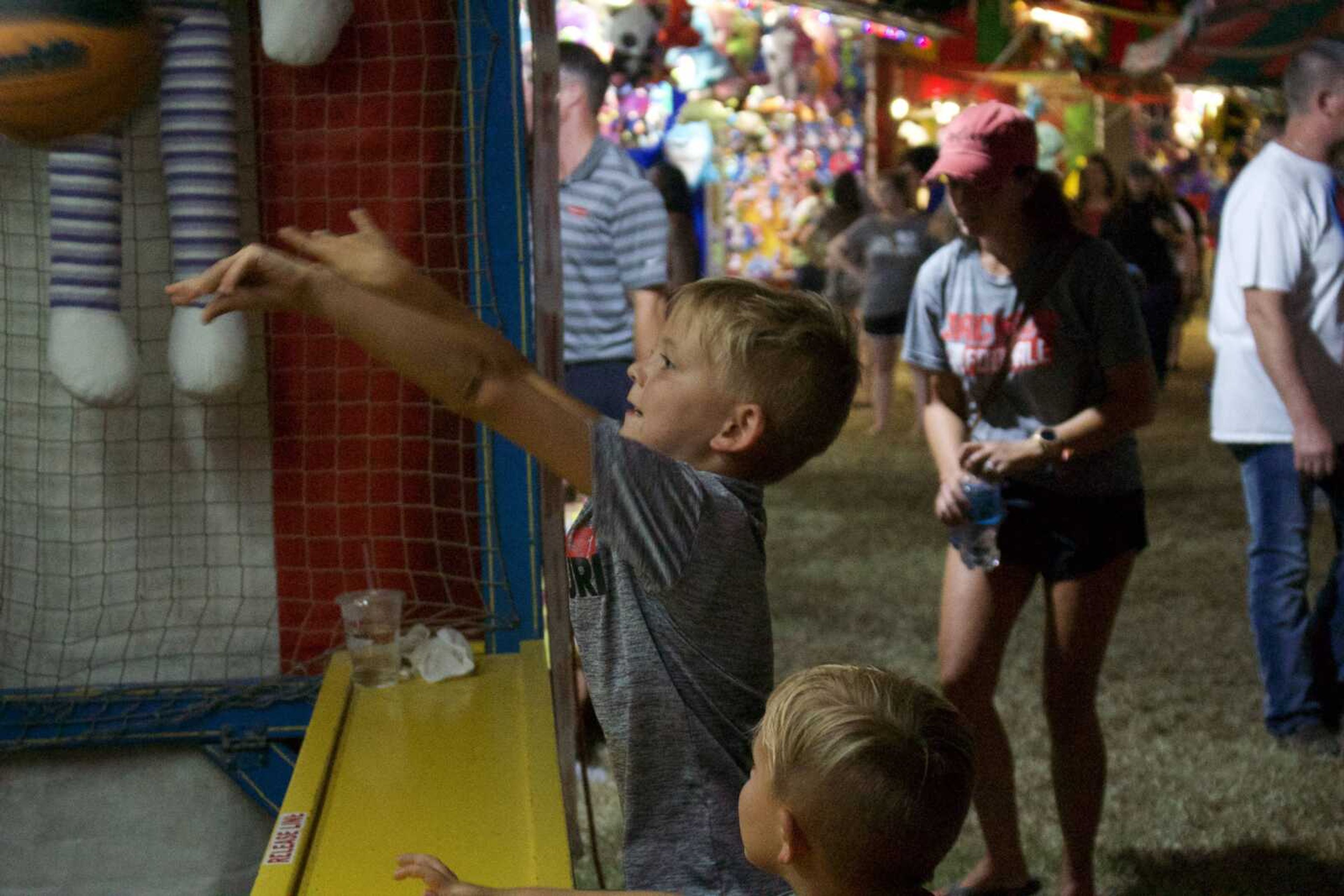 Community member Hugh Moon shoots a basket at a booth at the SEMO District Fair on Wednesday, Sept. 11.