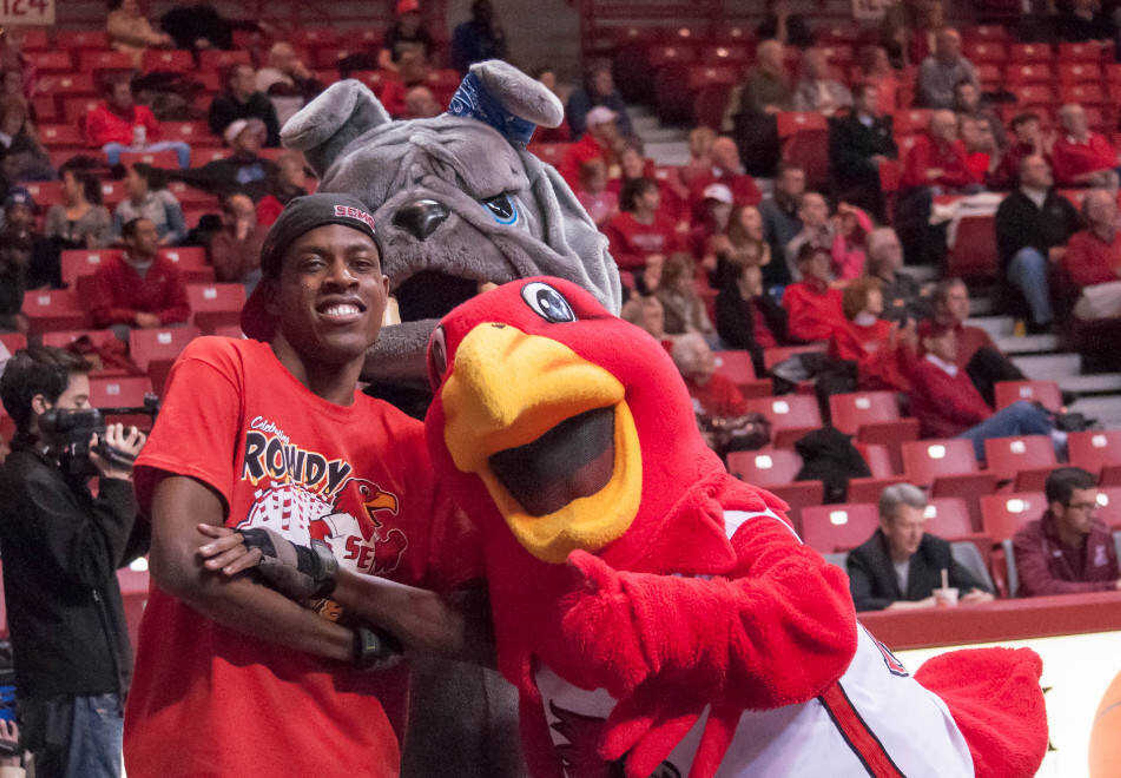 Derrick Liddell posing with Rowdy and the opposing team's mascot at a Southeast men's basketball game.  Photo by Alyssa Brewer