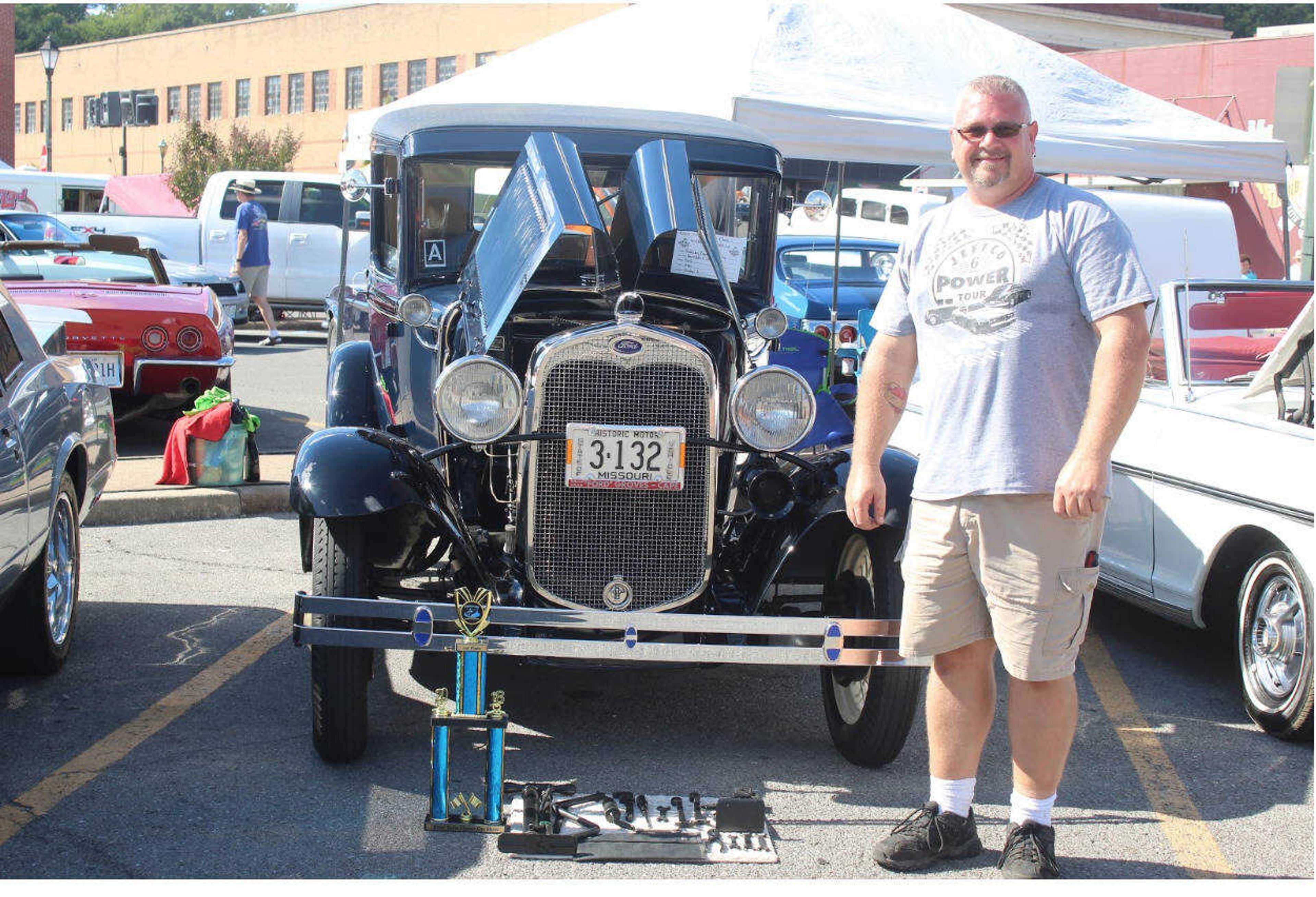 Dave Smith with his first place trophy in front of his 1932 Ford Model A.