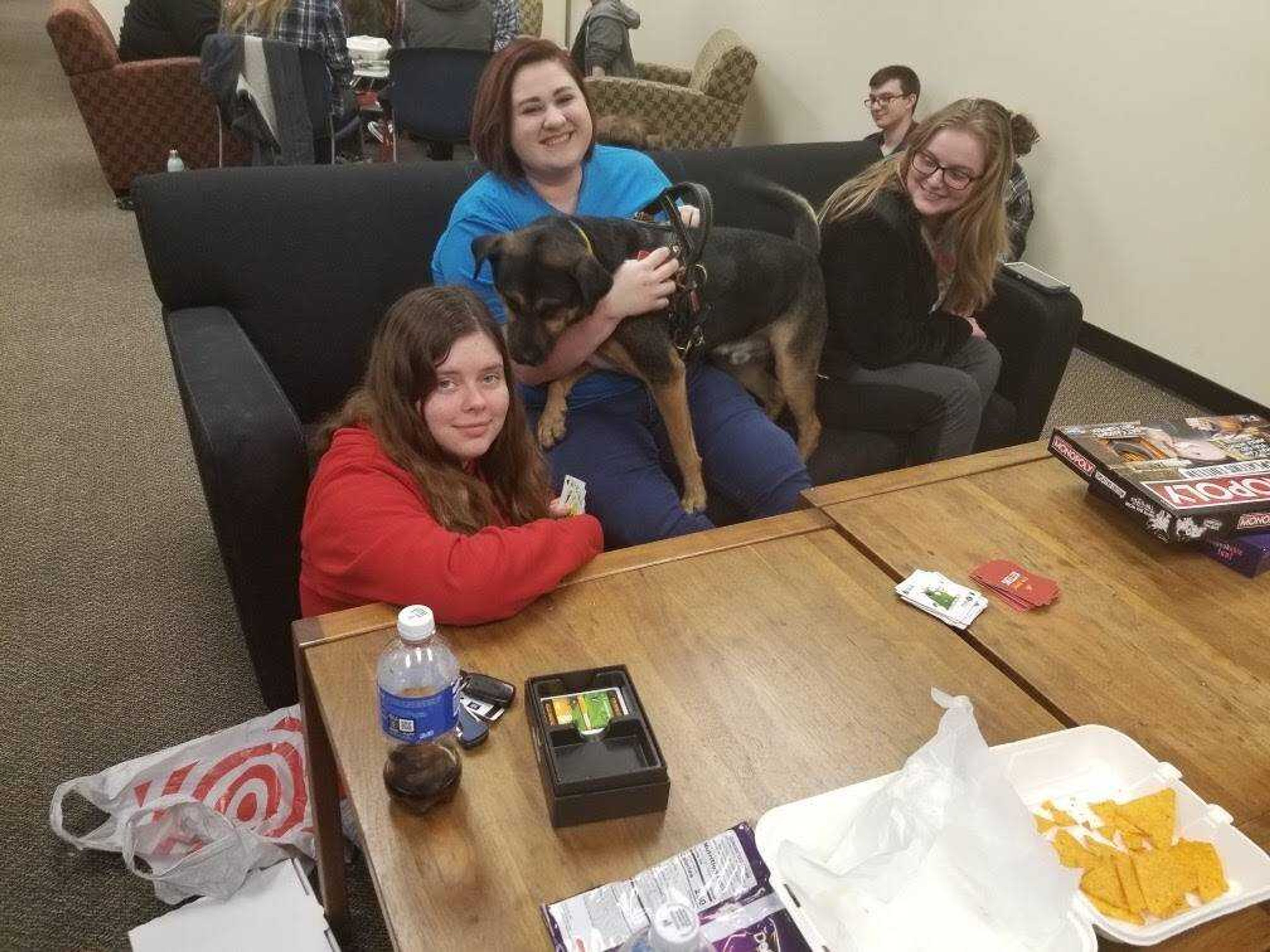 PRIDE Treasurer April Forshee (left) and former PRIDE Executive Board members Sidney Pribble (middle) and Jaedyn Weimer (right) play Exploding Kittens at the Feb. 27 PRIDE meeting in the Center for Student Involvement.