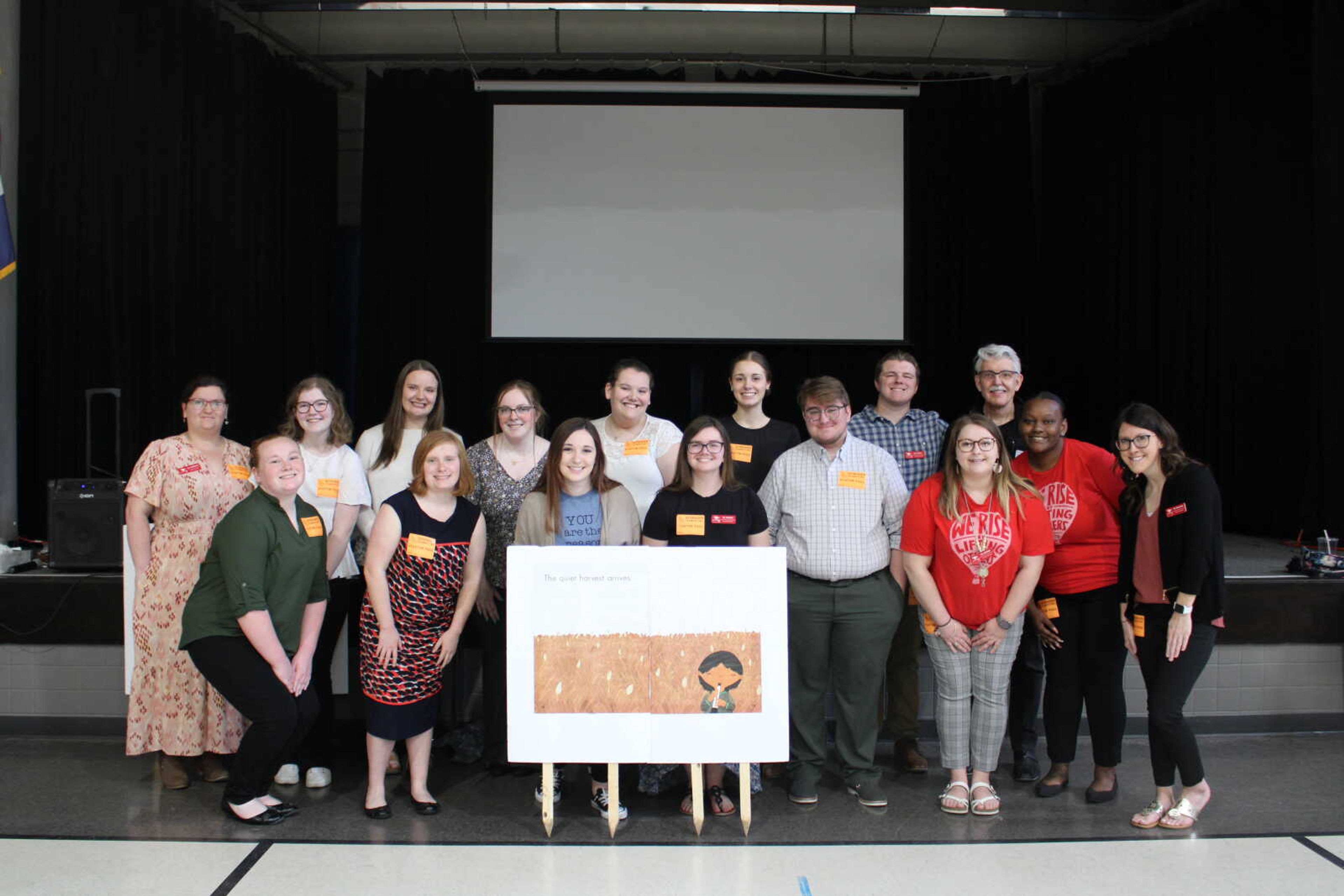 SEMO SMSTA poses for a picture with one of the storybook posters for the literacy walk. SMSTA is a part of Missouri State Teachers Association (MSTA), an organization that helps its members provide a stable learning community for Missouri's children.