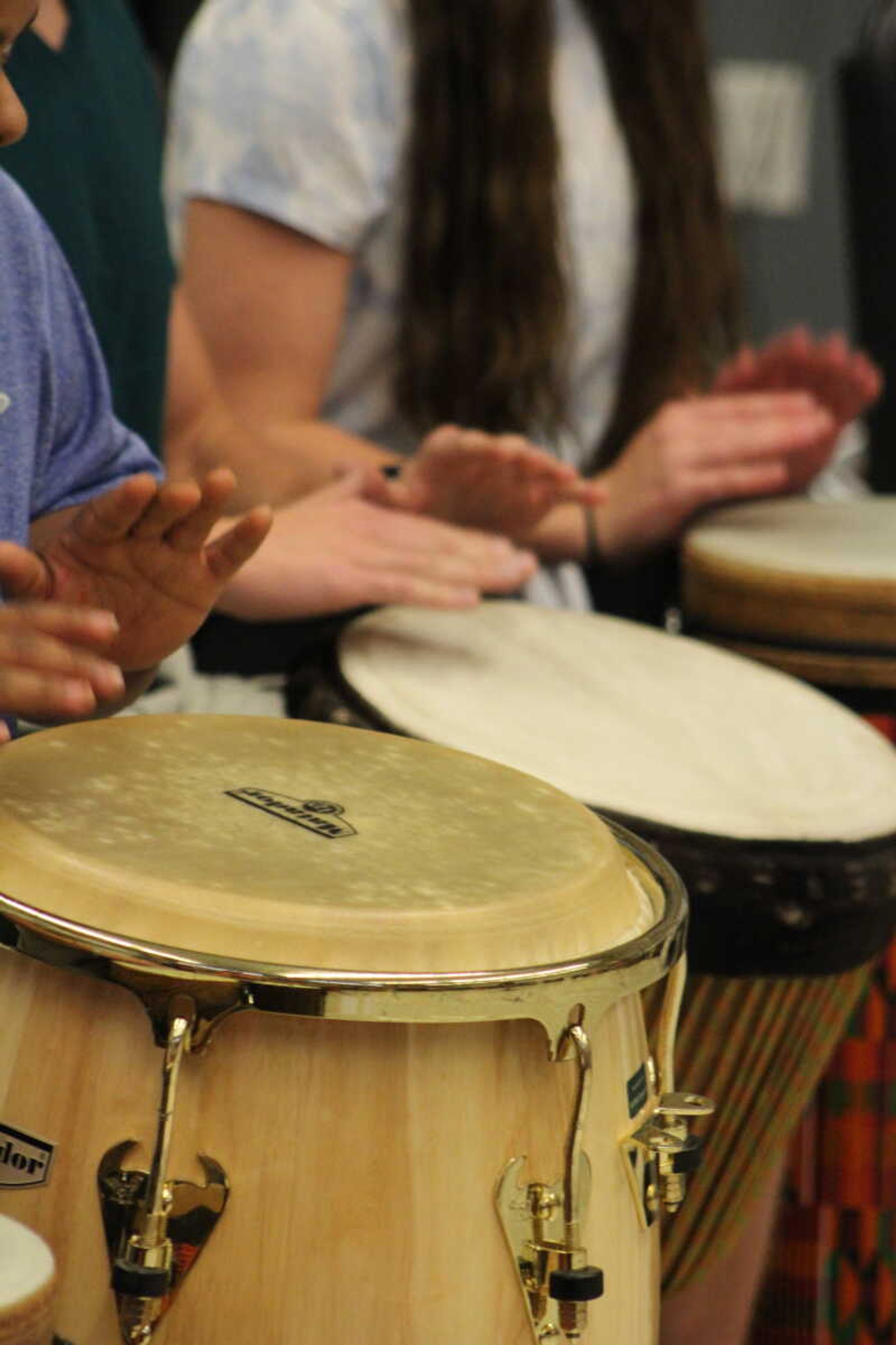 Drum Circle participants play at the Drum Circle event on Sept. 11.