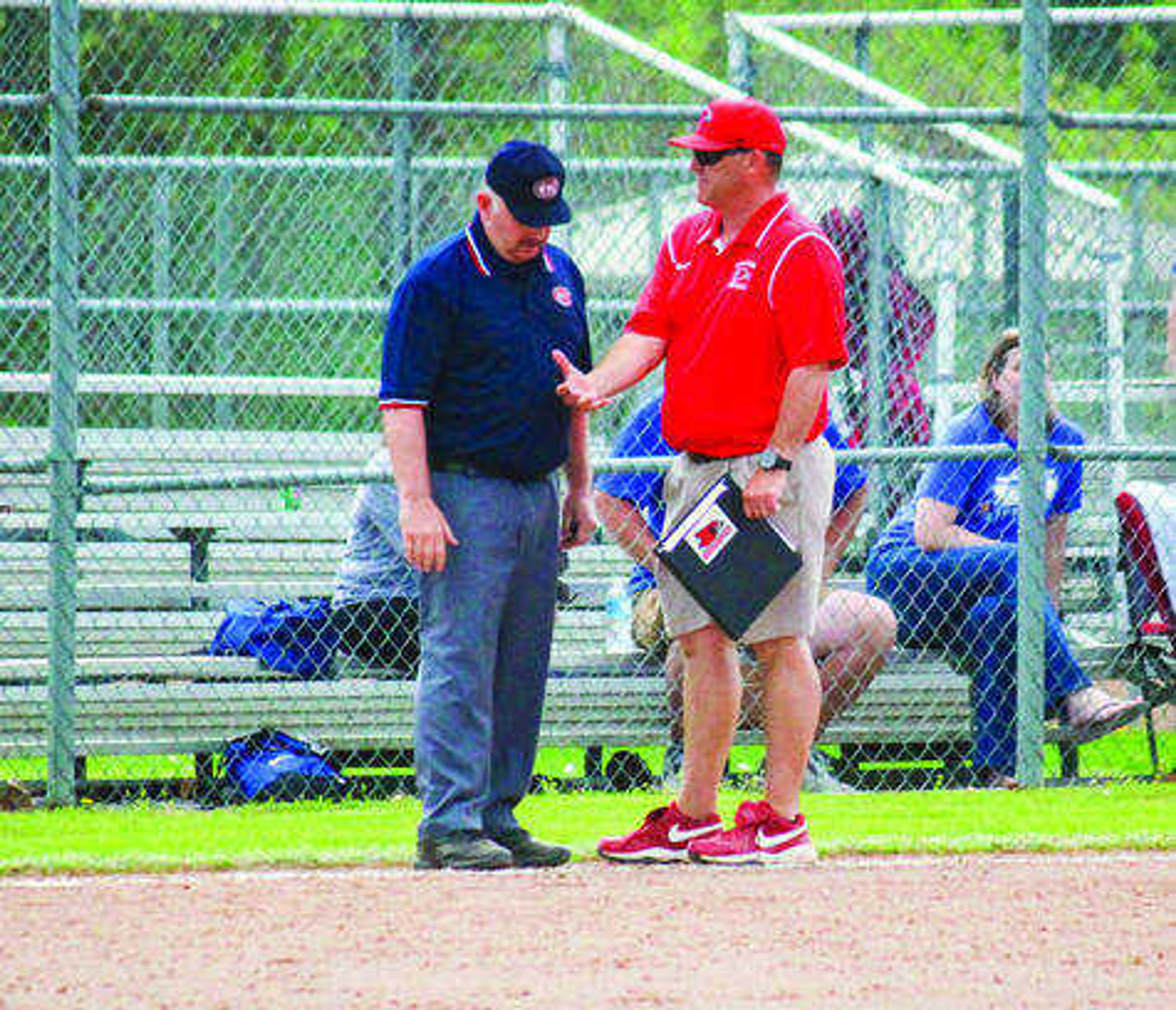 First-year Southeast Missouri State softball coach Mark Redburn has a discussion with an official during game two of the doubleheader on Saturday. Photo by Doc Fiandaca