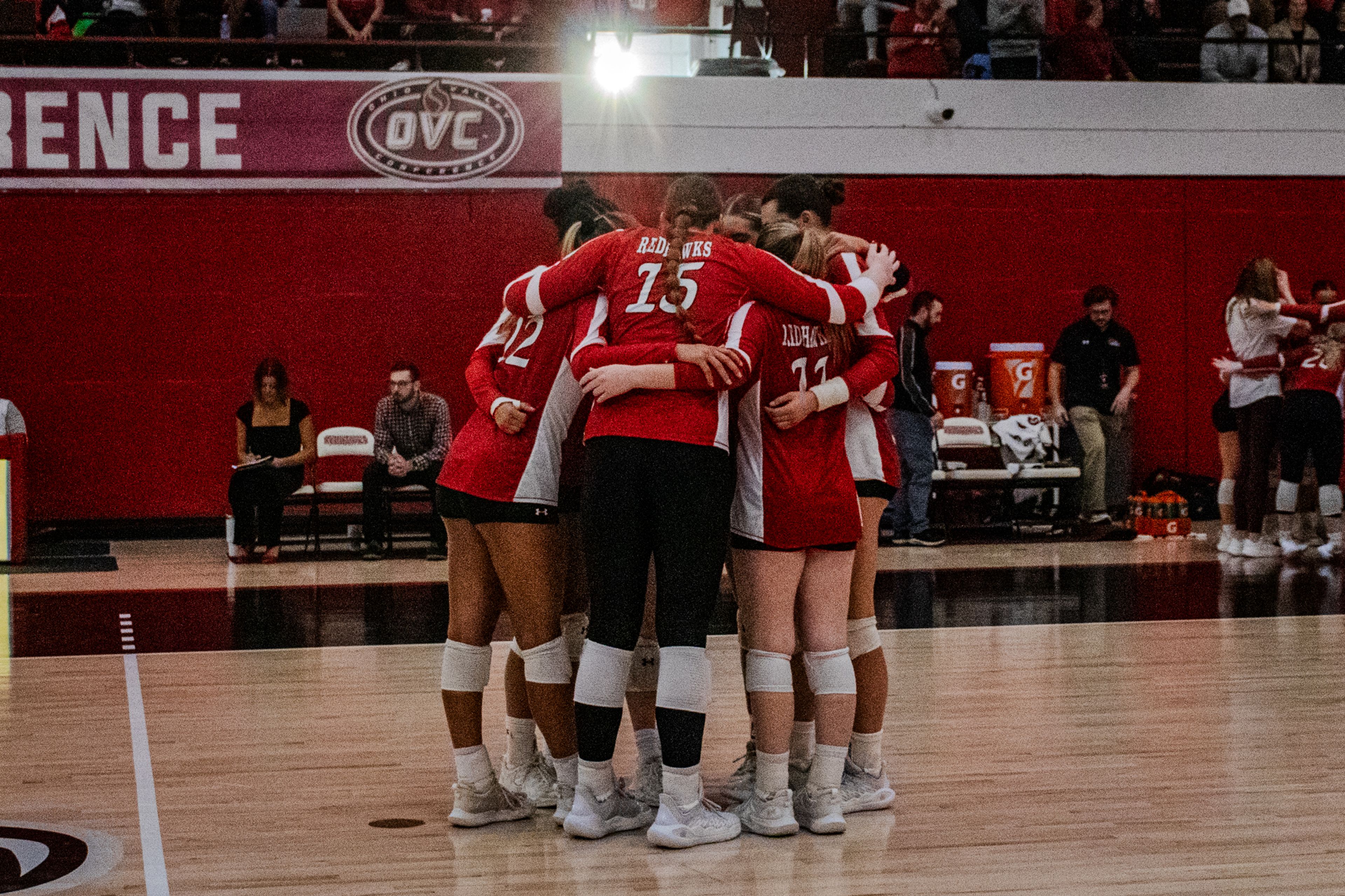 SEMO volleyball players huddle on the court before the start of their volleyball game.