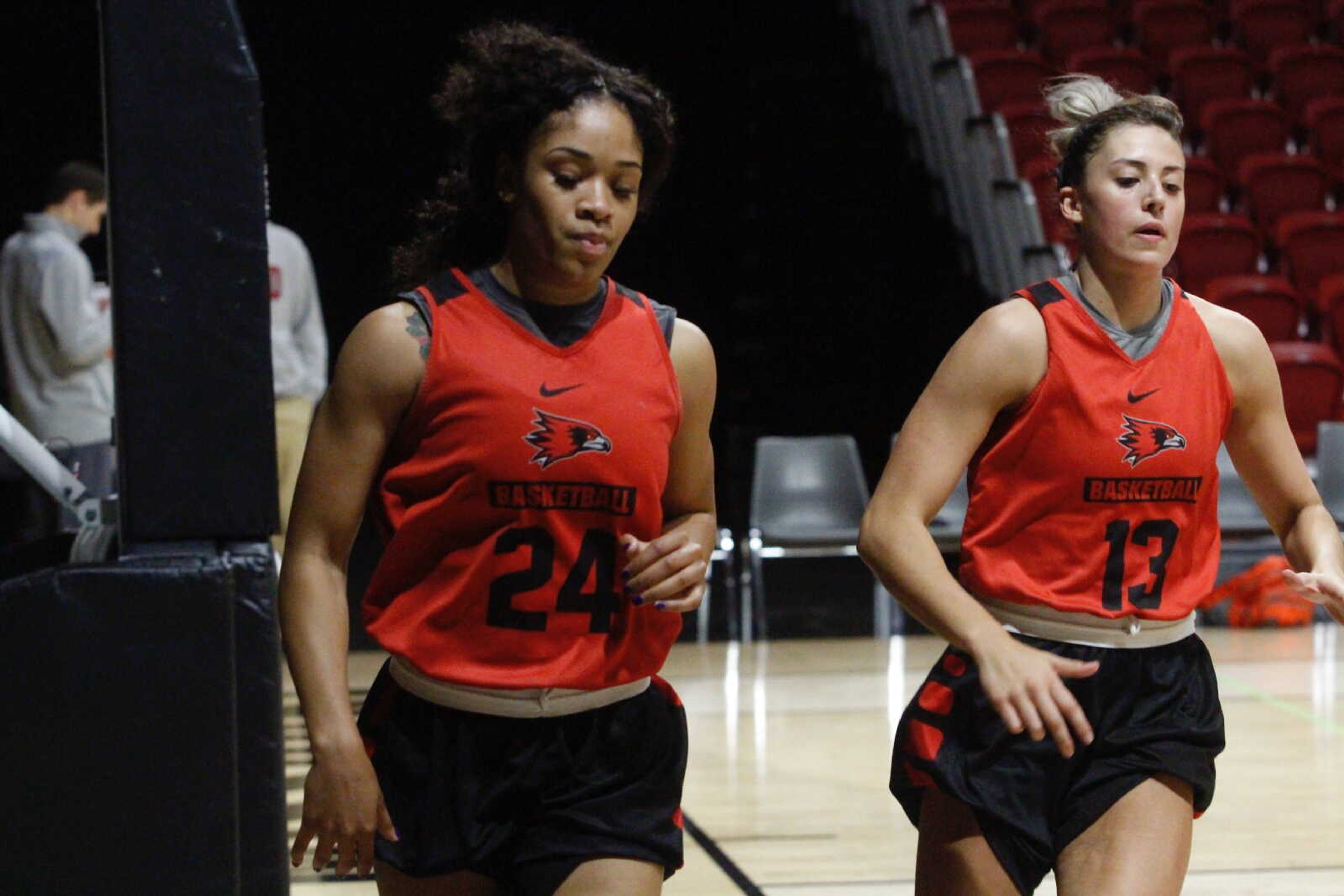 Sophomore guard Tesia Thompson and junior forward Jessie Harshberger run along the baseline during an October practice at the Show Me Center.