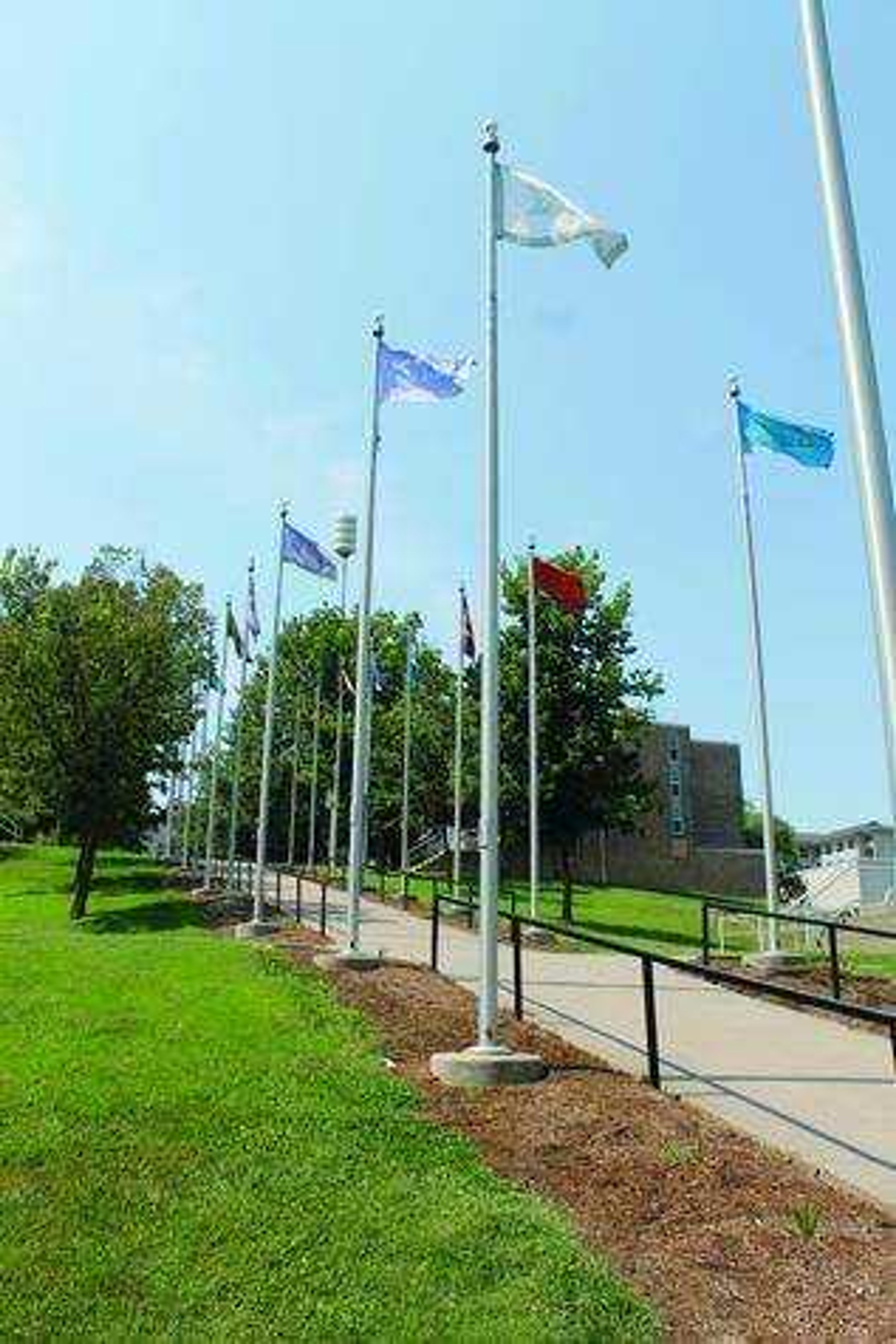 <b> Flags of fraternities and sororities on Greek Hill. </b> Photo by Drew Yount