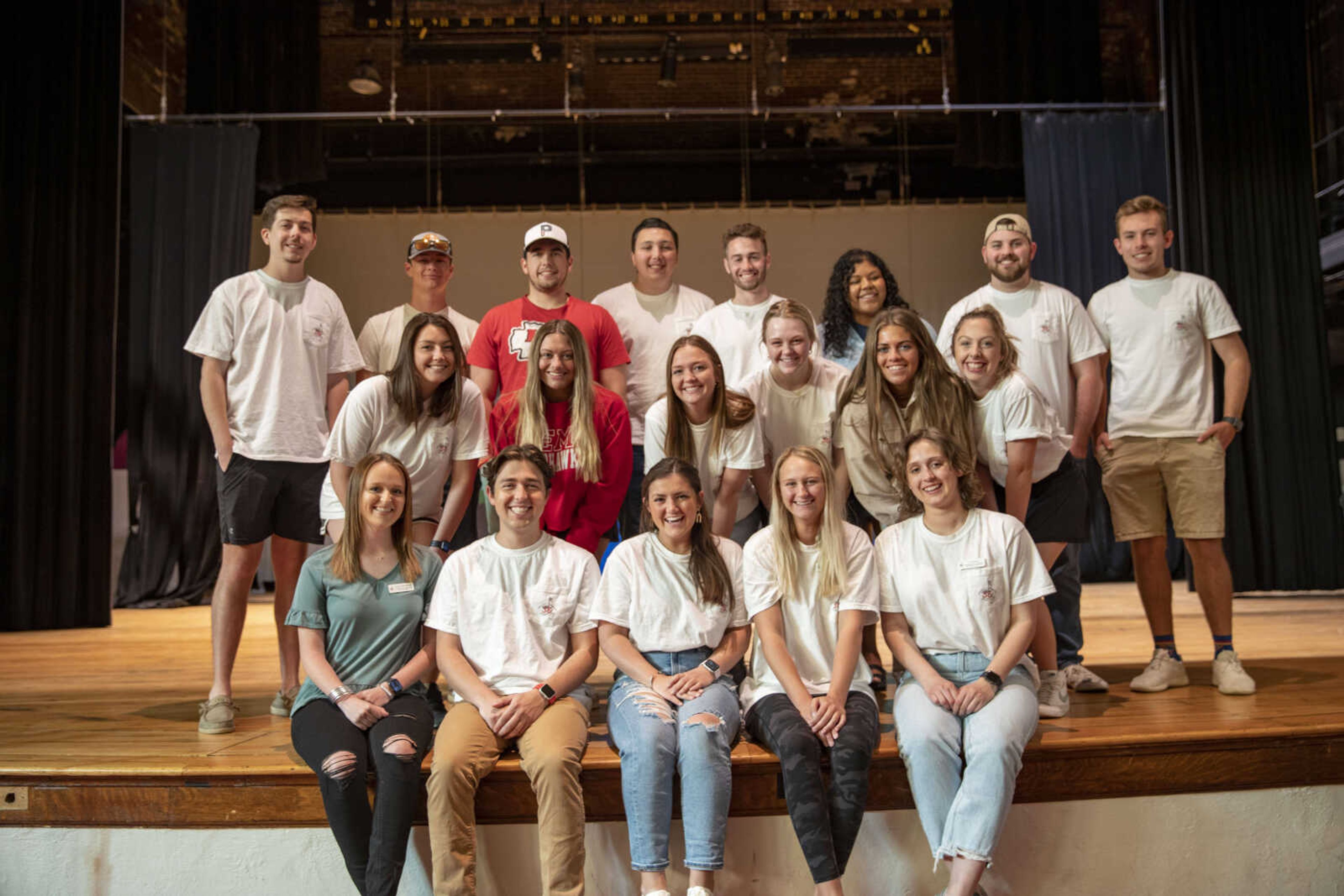 The 2022 Greek Week Committee poses for a photo on the Academic Hall stage. Director of Greek Week Committee Haley Taylor smiles in the center of the front row. The Awards ceremony on Sunday, April 10, wrapped up Greek Week.