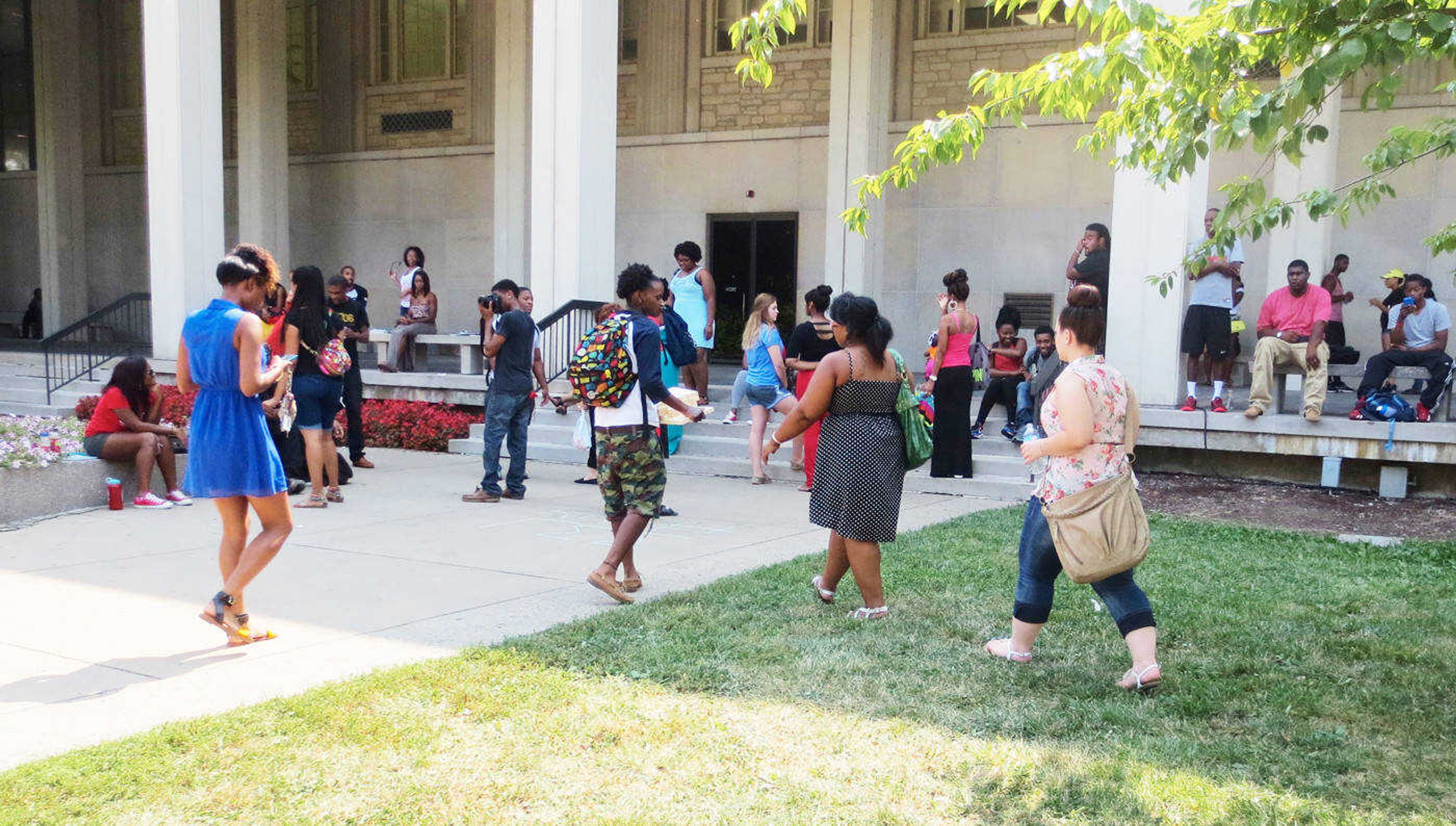 <b>Alpha Phi Alpha members gather outside Kent Library. The organization supplies weekly music to anyone who wants to socialize.</b> Photo by Kirsten Trambley