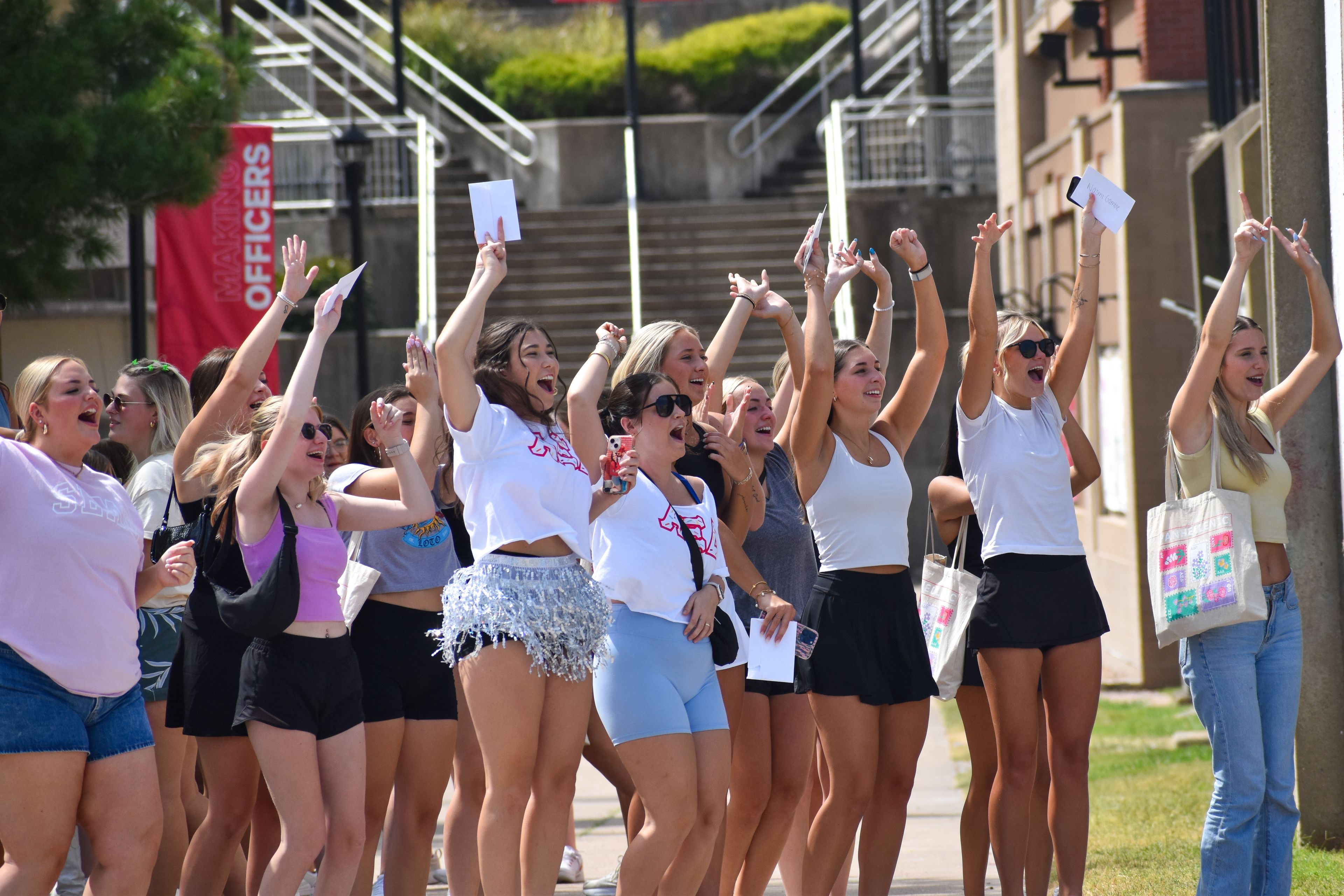 Alpha Xi Delta Pi Chis and new members prepare to run home on sorority bid day. 