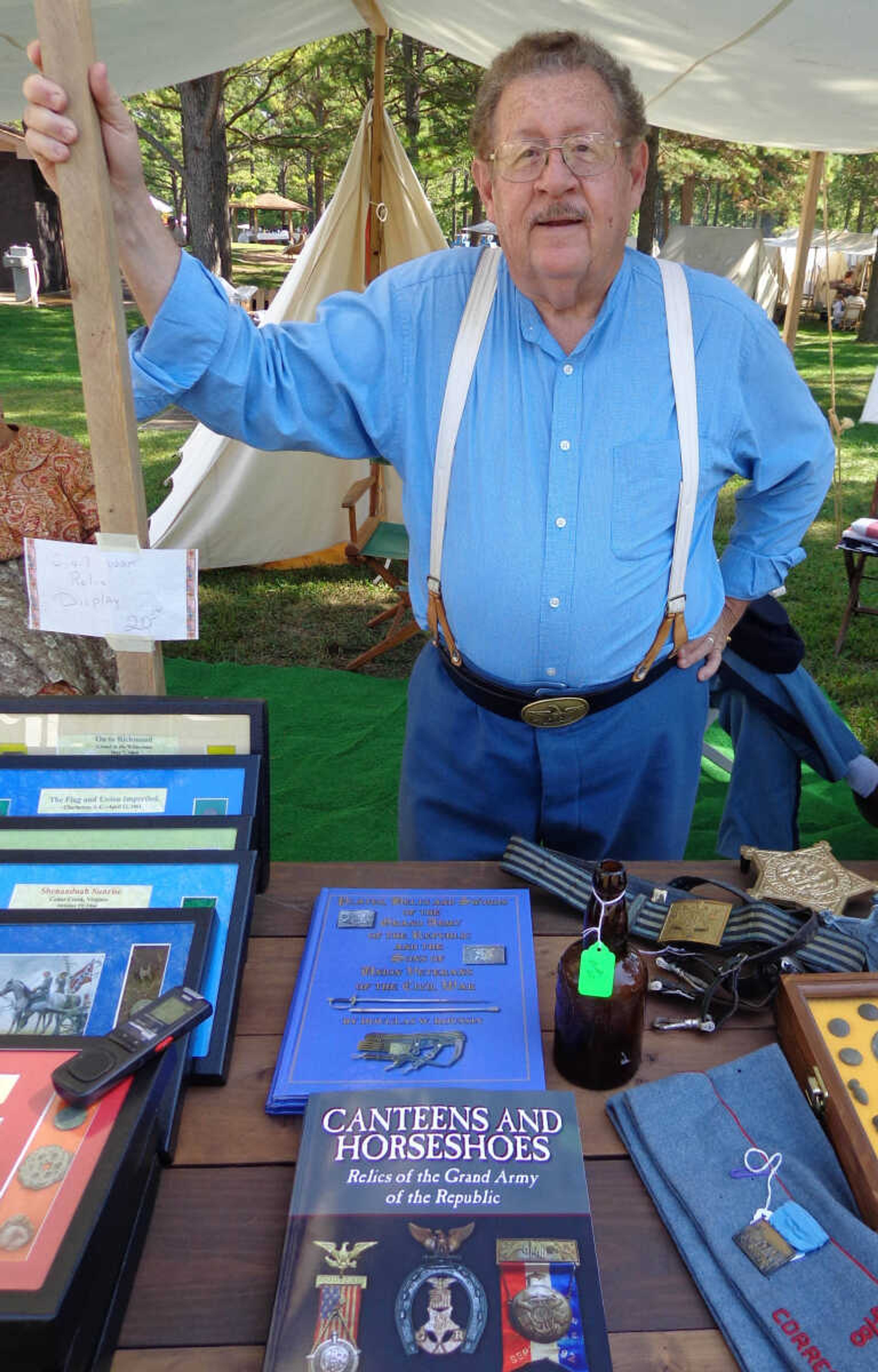 Douglas W. Roussin stands with his artifacts Photo by Doc Fiandaca